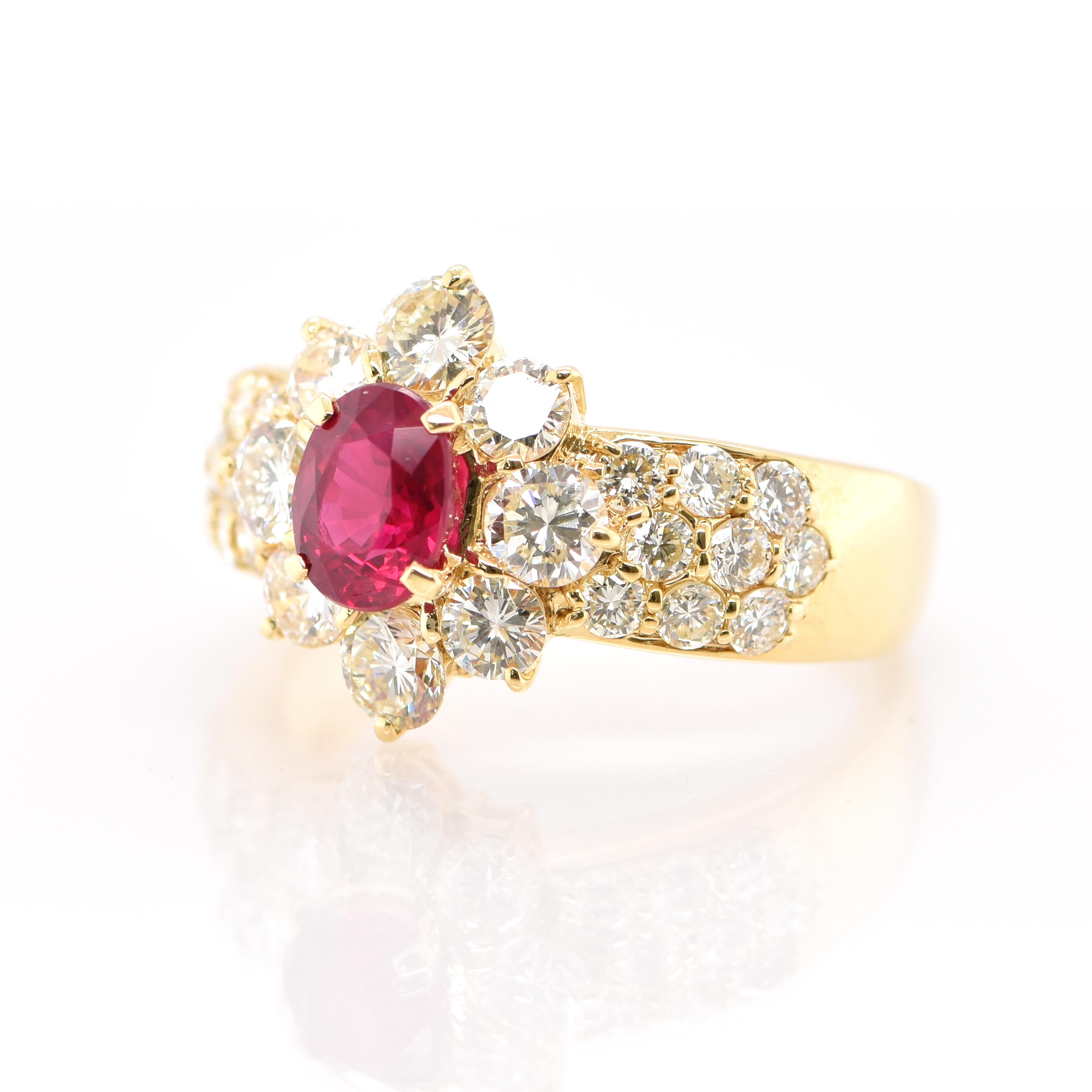 A beautiful Halo Ring featuring a GIA Certified 1.00 Carat Natural Burmese (Heated) Ruby and 1.80 Carats of Diamond Accents set in 18K Gold. Rubies are referred to as 