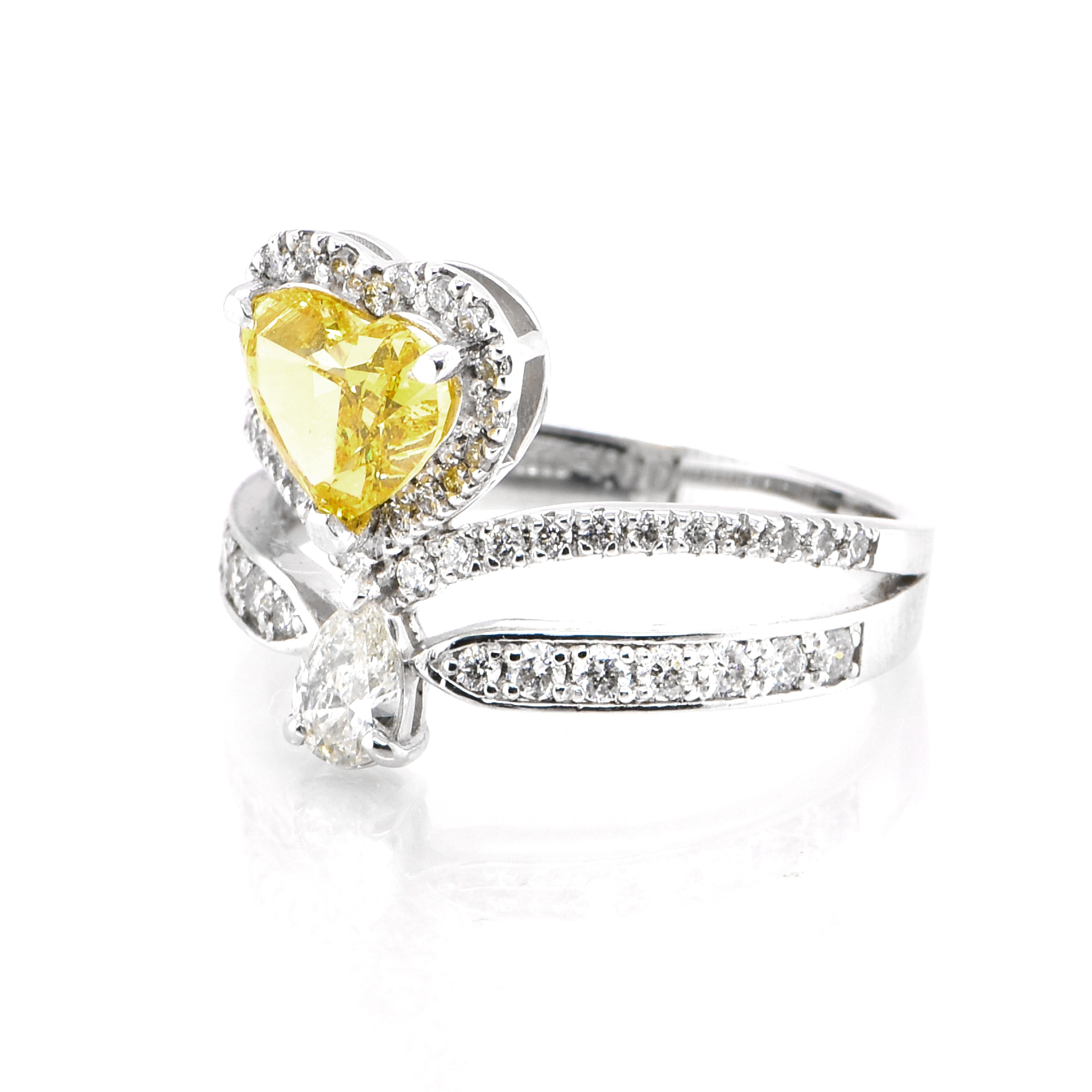 A beautiful ring featuring a GIA Certified 1.00 Carat Natural Fancy Vivid Orange Yellow Diamond and 0.64 Carat Diamond accents set in Platinum. Diamonds have been adorned and cherished throughout human history and date back to thousands of years.