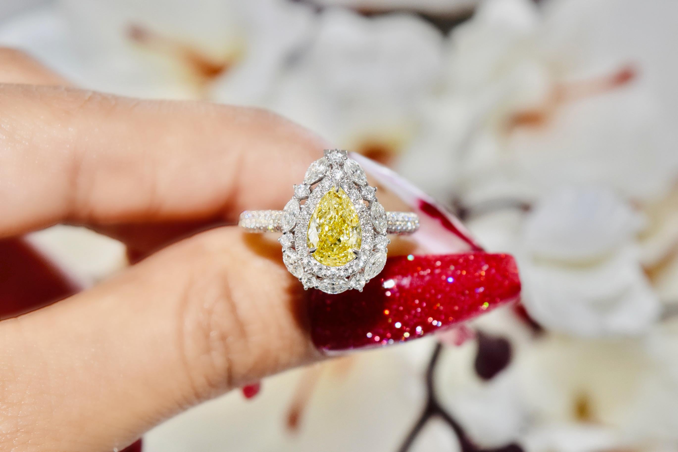 18kt white gold Ring & Convertible Pendant with diamonds
  
  Gold colour & karat: White gold 18kt
  Weight: 4.35 grams
  
  Set with-
  Stone type: Diamonds
  Shape: Pear
  Carat: 1.00
  Colour: W-X  
  Clarity: I2
  
  Surrounding Stones:
