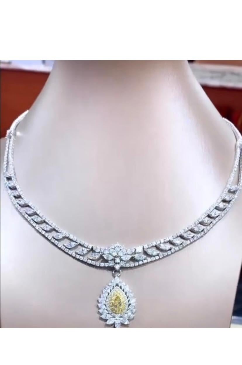 A stunning necklace features a breathtaking fancy diamond pendant , so elegantly and refined.
The necklace is further adorned with  vibrant and sparkling  diamonds , adding a touch of glamour and sophistication to the already magnificent piece.Truly