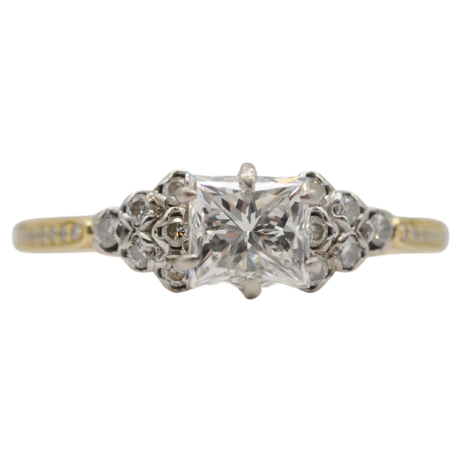 Introducing a stunning princess/Rectangular modified brilliant cut diamond certified by the Gemological Institute of America (GIA) set in an exquisite 18k yellow gold ring, adorned with delicate brilliant accents to enhance the charm of the large