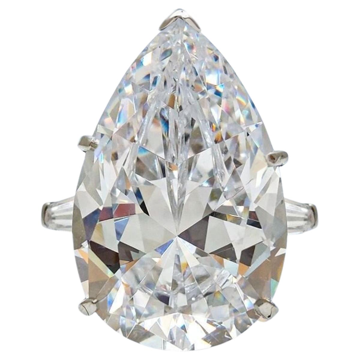 Contemporary GIA Certified 10.01 Carat Pear Cut Diamond Ring with tapered baguette For Sale