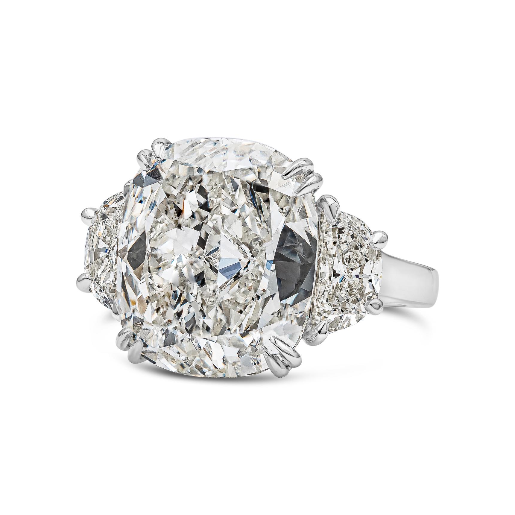 A beautiful engagement ring style, featuring a 10.02 carat elongated cushion cut diamond certified by GIA as I color and VS1 clarity, set in a polished platinum mounting. The center diamond is flanked by a half moon diamond on either side, weighing