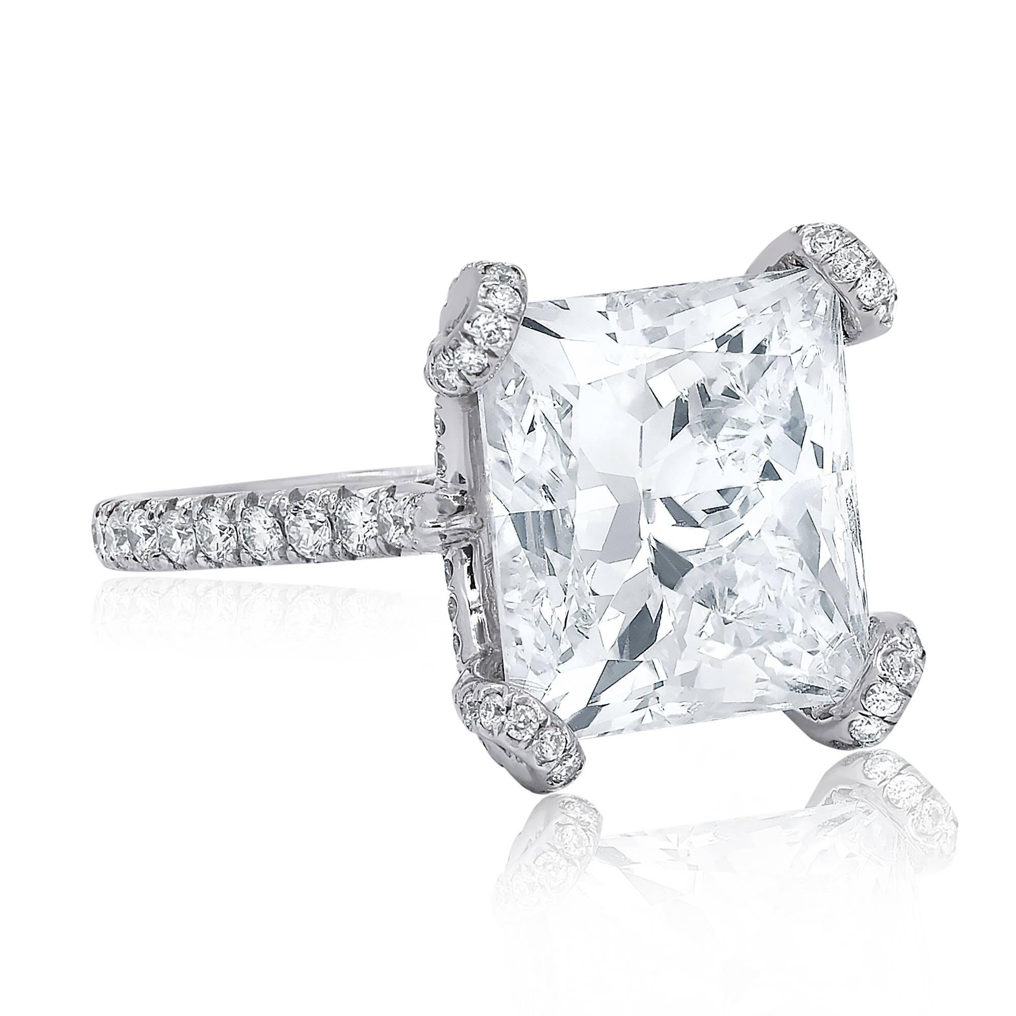 Certified Platinum diamond engagement ring with rectangular modified brilliant cut diamond in the center, weighing 10.02 carat J color/SI1 clarity and accented by 1.00 cts micro pave round brilliant cut diamonds on the side.