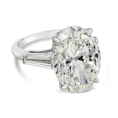 Anillo de compromiso de platino de tres piedras con diamante talla oval certificado por el GIA de 10.03 quilates