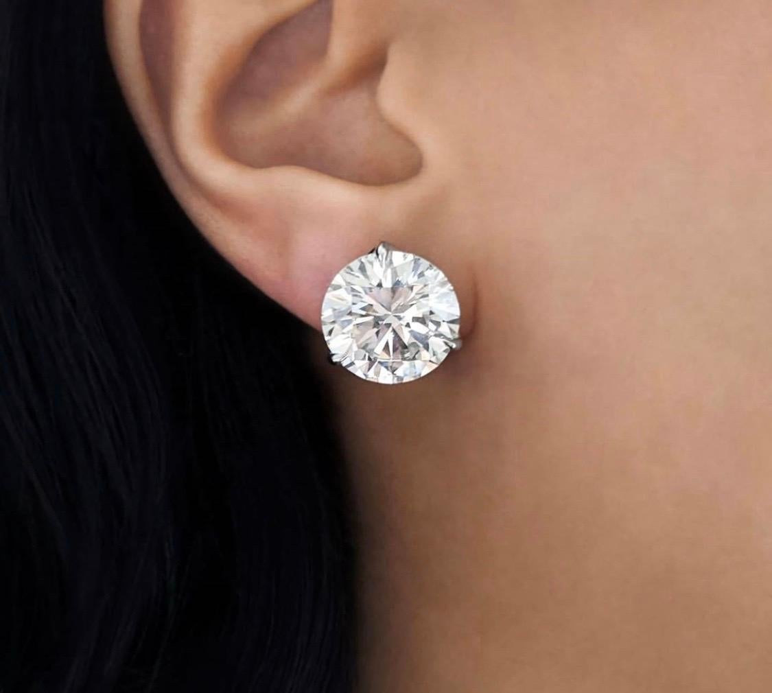 These important diamond stud earrings are perfectly matched. graded by the GIA as 5.02  Carat each, J Color SI2 clarity, 3X (Excellent cut, Excellent polish and Excellent symmetry) no fluorescence. 
These super white faced Diamonds are brilliantly