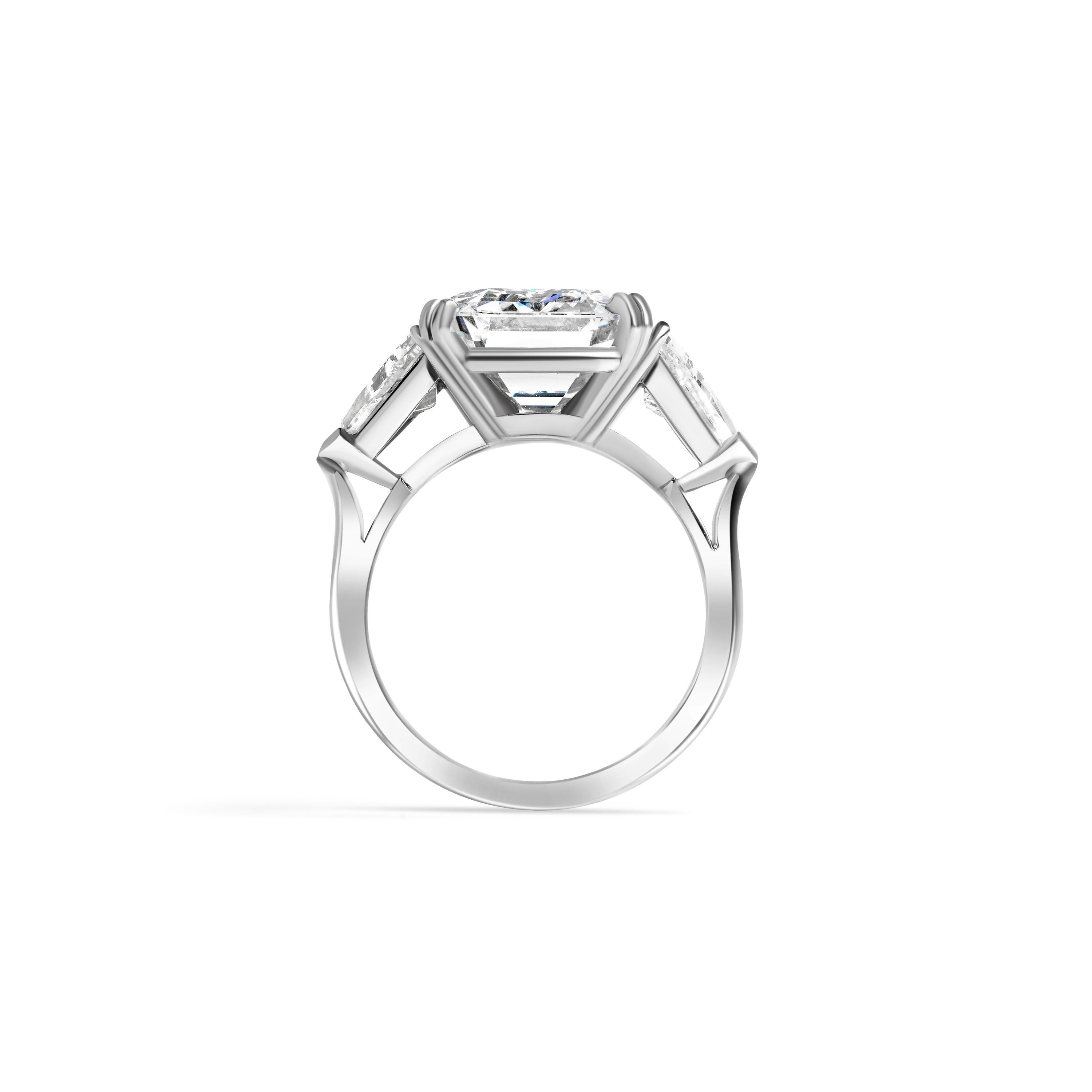 If you are looking for a showstopper this ring is it. Crafted in Platinum Featuring one 10.05 carat Emerald Cut diamond with an E color and VVS2 clarity. The diamond comes with a GIA certified report #5221334024. Flanking the center stone are (2)