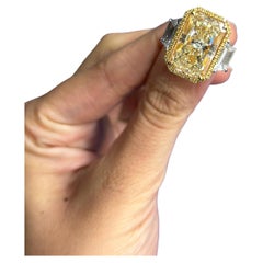 GIA Certified 10.05 Carat Radiant Cut Yellow Diamond Three Stone Ring 