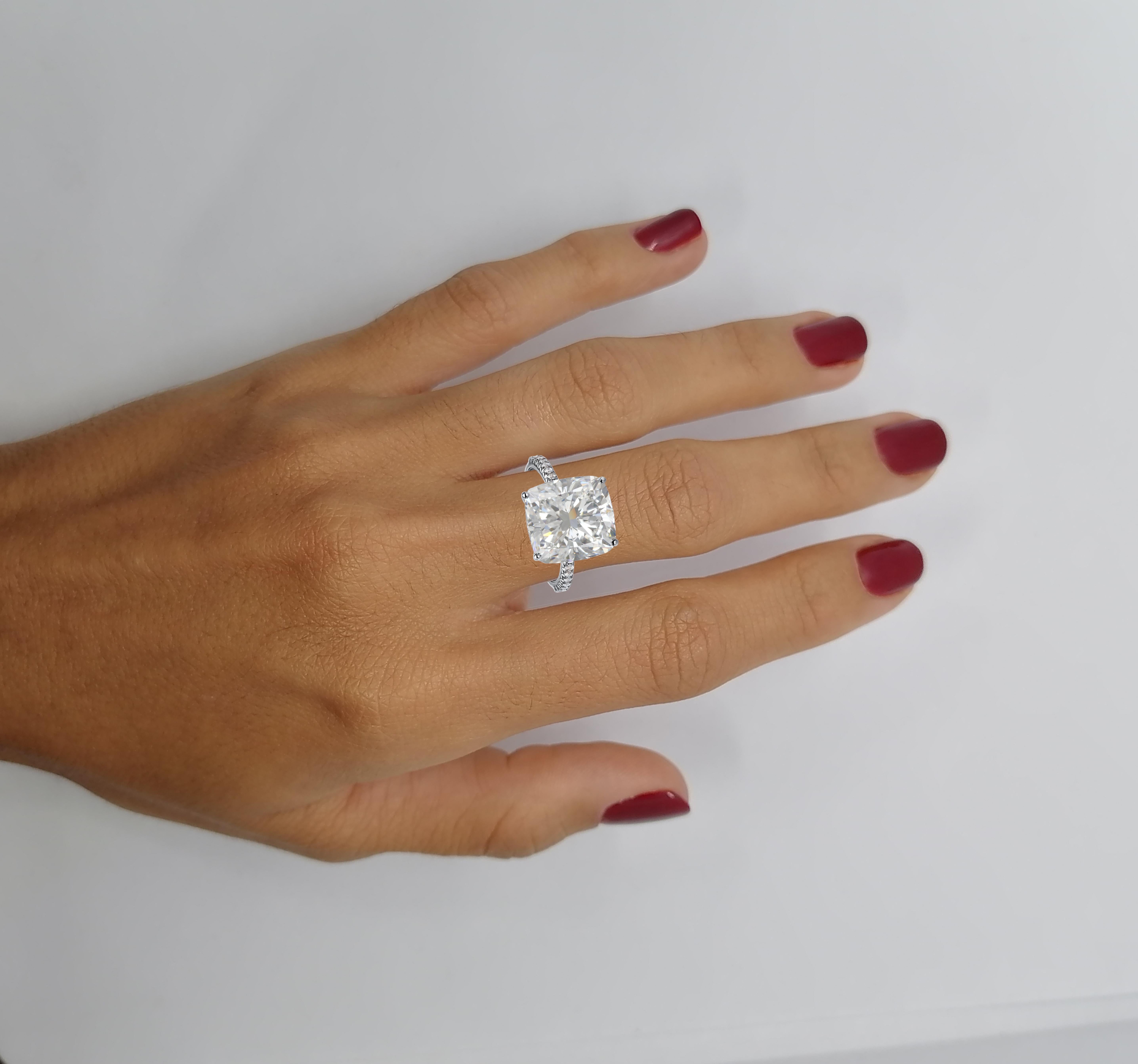 A 5.70 carat diamond full of brightness. Set in handcrafted platinum ring this elongated cushion is extraordinary being VVS2 in clarity is extremely rare to find such a pure diamond with this carat amount and F color being extremely