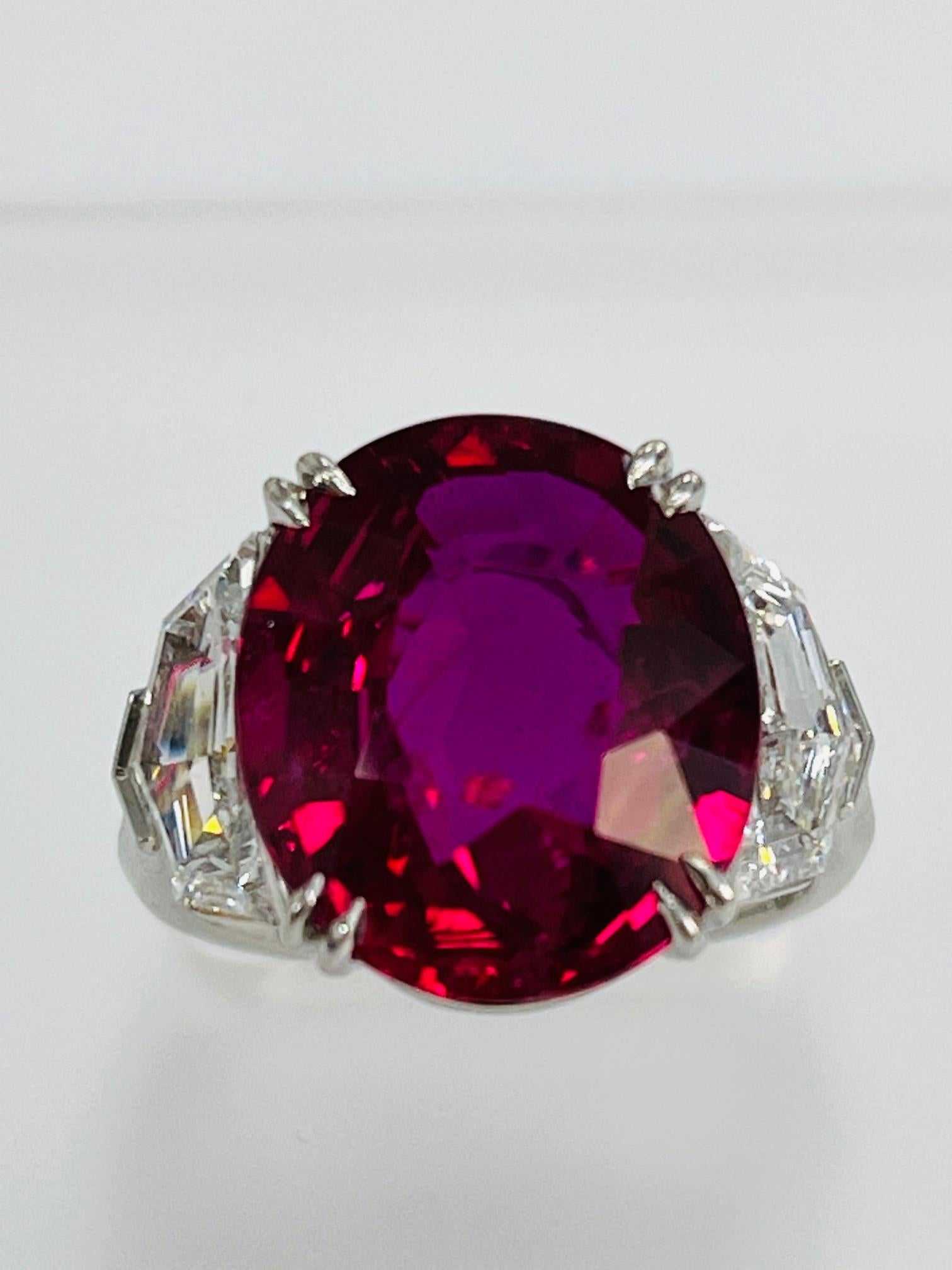 
10.06 Carat oval ruby , Mozambique , GIA certified , Heat , set in hand made paltinum ring with 1.90 carat fancy cut 