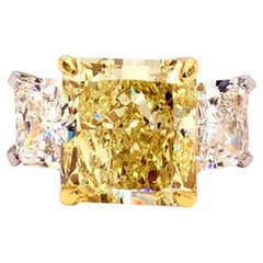 GIA Certified 10.08 Carat Radiant Fancy Yellow Three Stone Diamond Ring