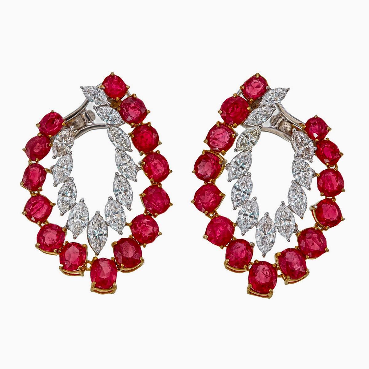 These luxurious ruby and diamond earrings are handcrafted by Rewa jewels in 18 karat white gold.

The main highlights are the 28 pieces untreated Burmese rubies weighing approximately 10.08 carat total.

Additionally it has 22 pieces of marquise