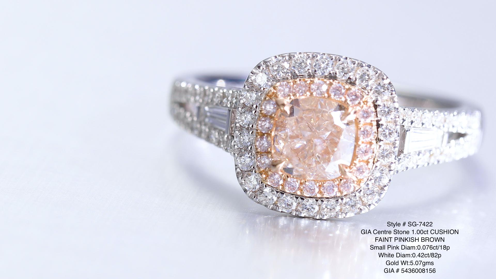 the GIA Certified 1.00ct Cushion Natural Fancy Faint Pinkish Brown Diamond Ring. This exquisite ring is crafted from lustrous 18kt gold, providing a luxurious backdrop for its remarkable centerpiece.

At the heart of this enchanting ring lies a