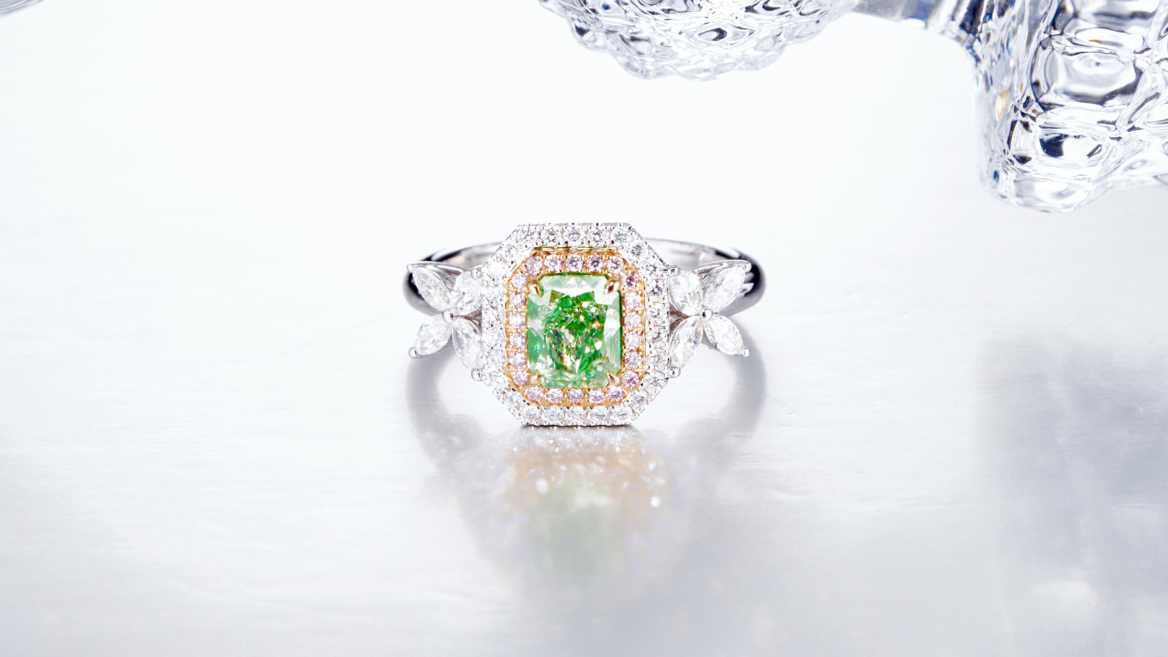 GIA Certified 1.00-carat Natural Fancy Light Green-Yellow Radiant Solitaire Ring. The centerpiece of this exquisite ring is a radiant-cut diamond, certified by GIA for its exceptional quality and natural fancy light green-yellow hue. The captivating