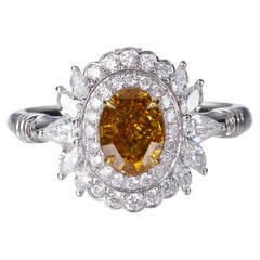 Bague 18 carats, certifiée GIA, diamant ovale de couleur naturelle jaune-orange foncé fantaisie de 1,00 carat
