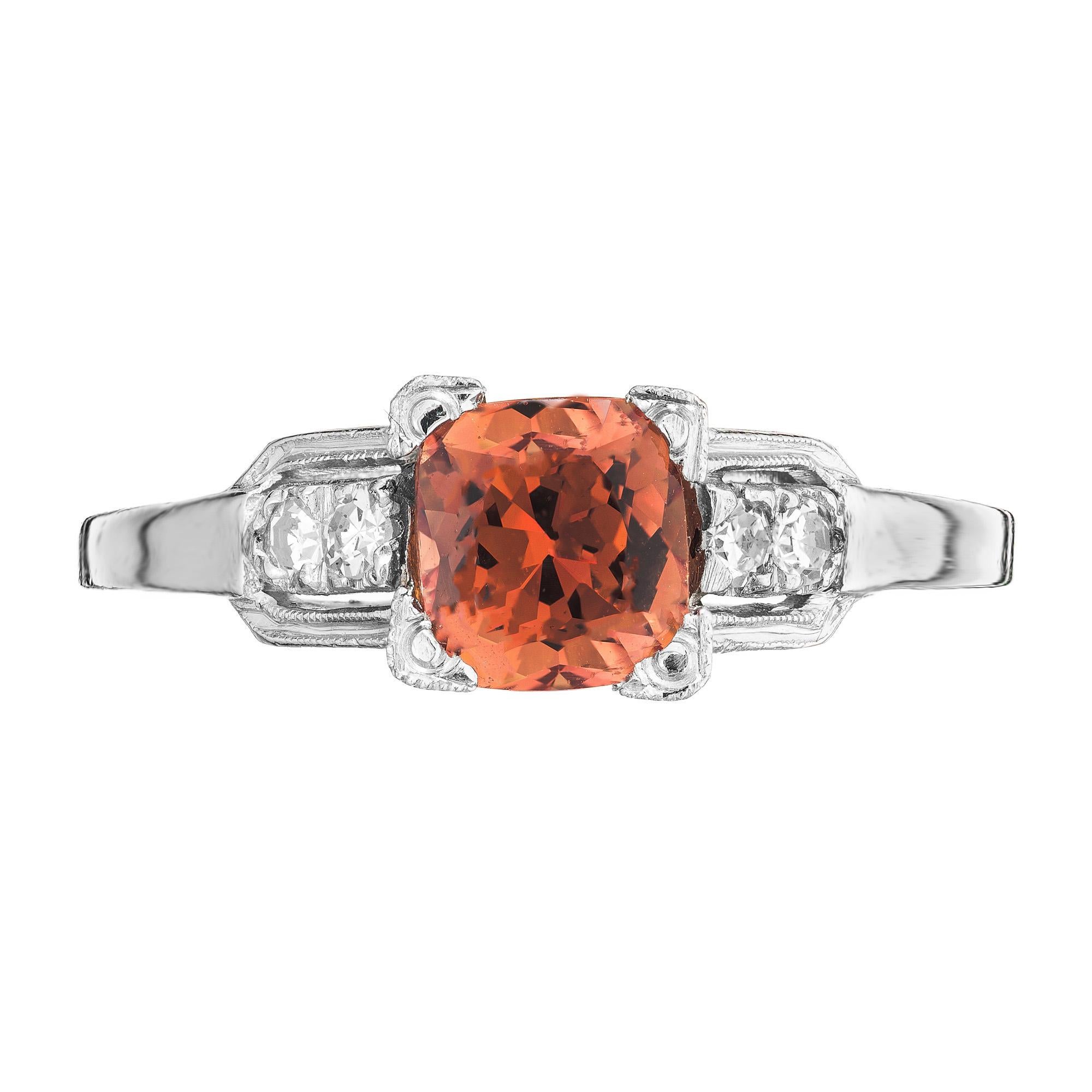 Exquisite Art Deco 1940's sapphire and diamond engagement ring. Unique 1.01ct cushion shape orange and brownish sapphire accented with 2 single cut diamonds on each side of the platinum setting. GIA has certified the sapphire as natural, no heat.