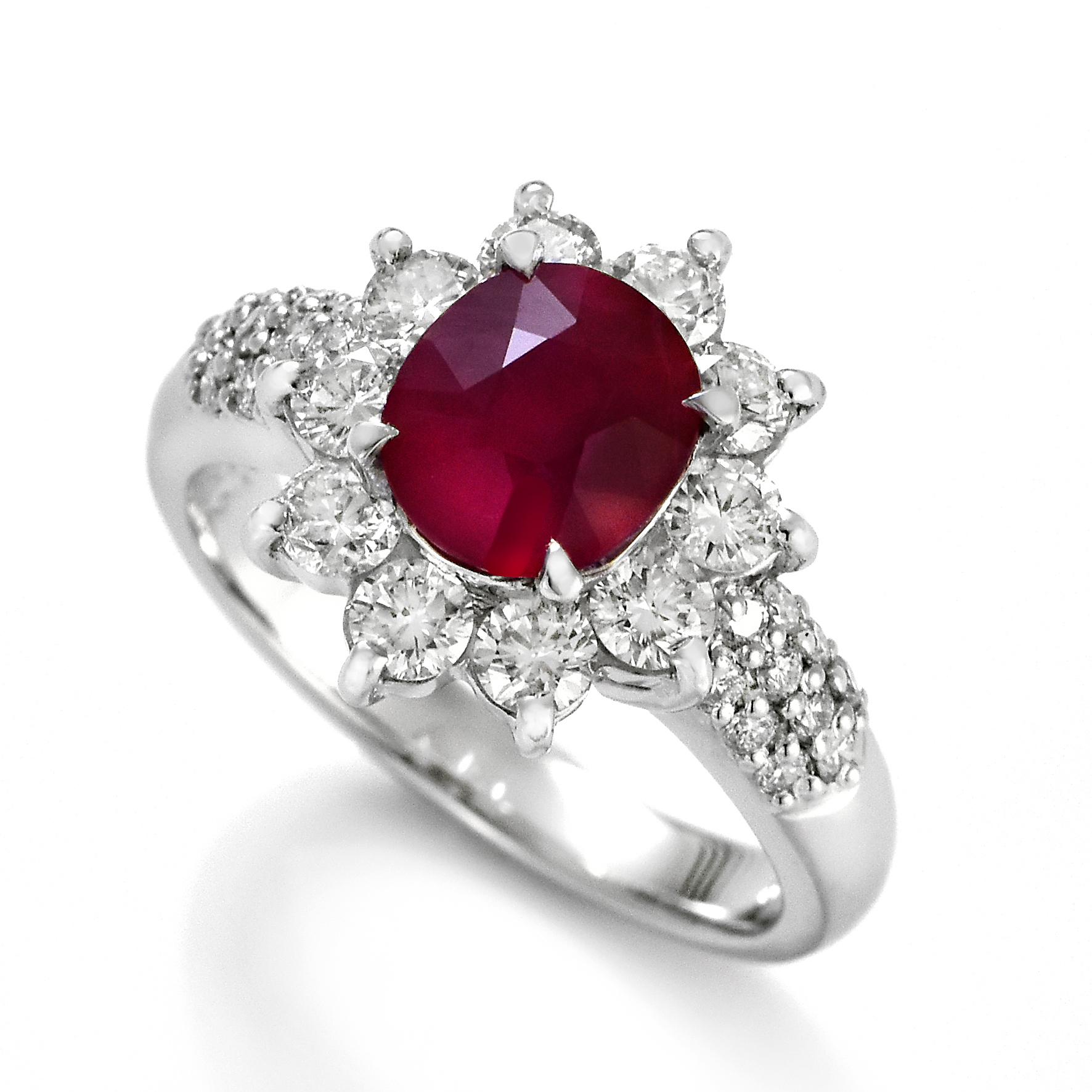 A beautiful Ring set in Platinum featuring a GIA Certified 2.08 Carat Natural Burmese, Pigeon's Blood Ruby and 1.12 Carat Diamonds. Rubies are referred to as 