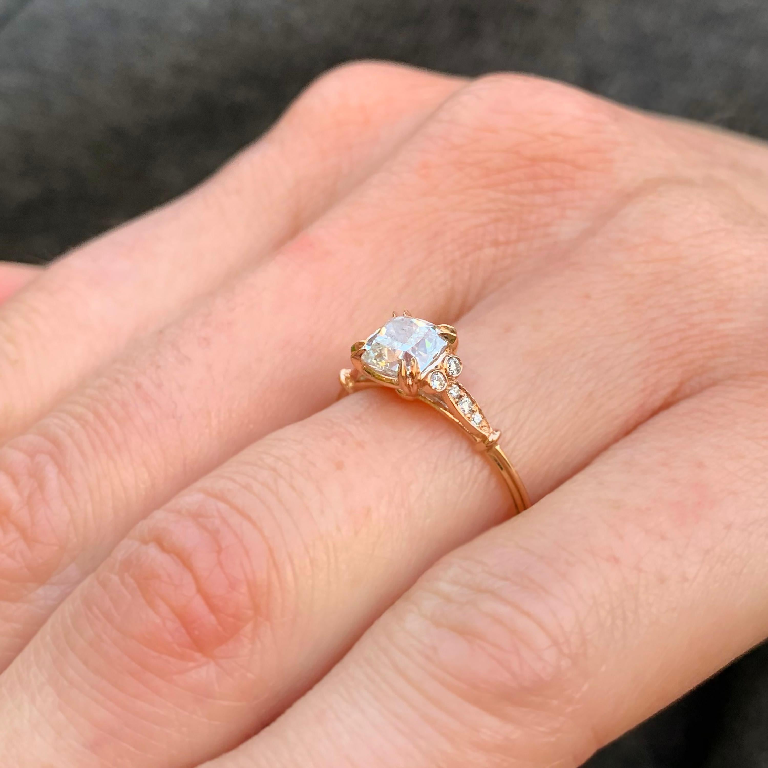 Hand crafted in 18k rose gold a perfectly unique diamond engagement ring. A signature Ronan Campbell design crafted in rose gold and set with a beautiful cushion cut diamond (1.01ct F VS2 GIA)
