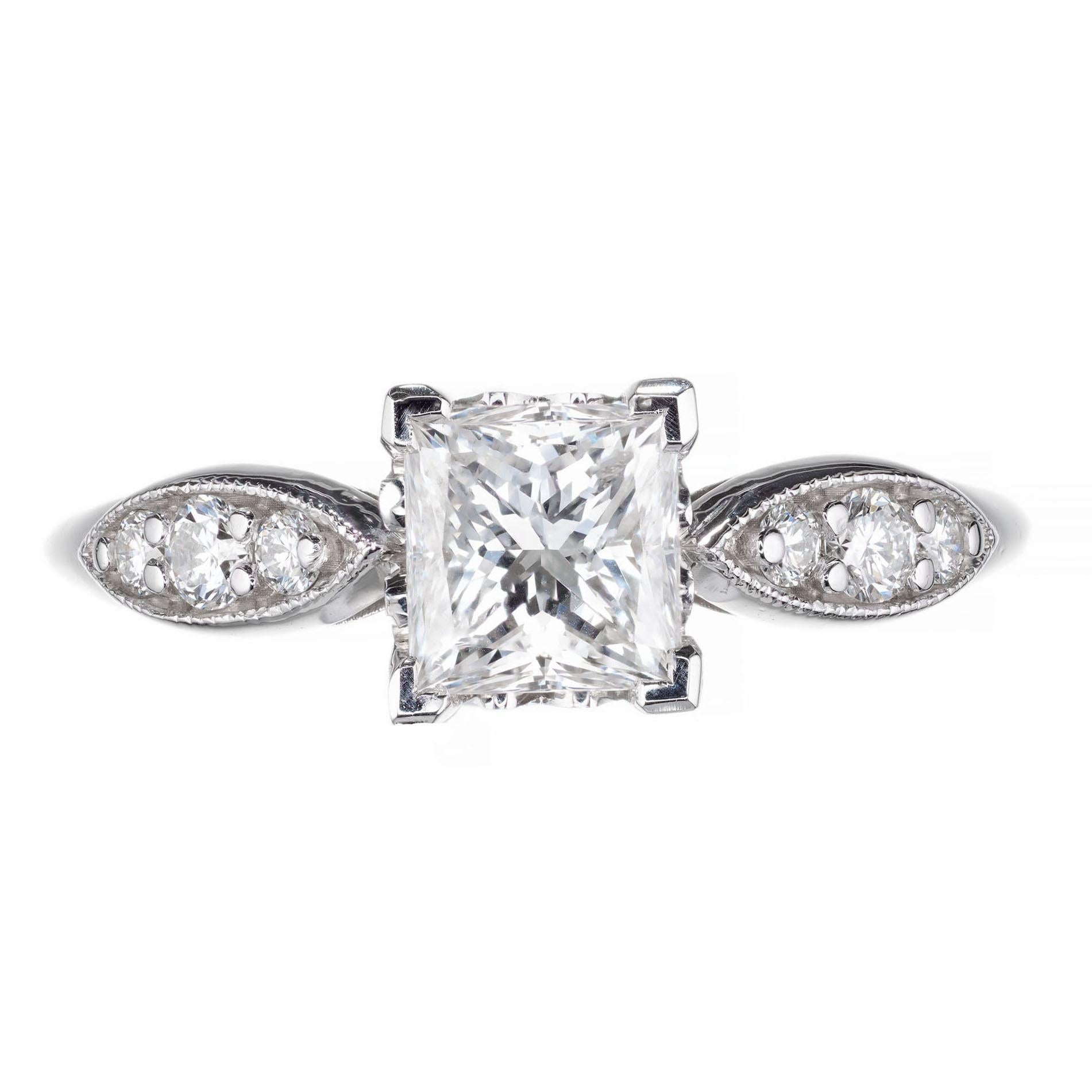 Princess cut diamond engagement ring. 14k white gold setting with a GIA certified center stone, with 6 round accent diamonds. 

1 princess cut diamond G SI, approx. 1.01ct  GIA Cert# 1195873378
6 round brilliant cut diamond G VS approx. .20ct
Size 7
