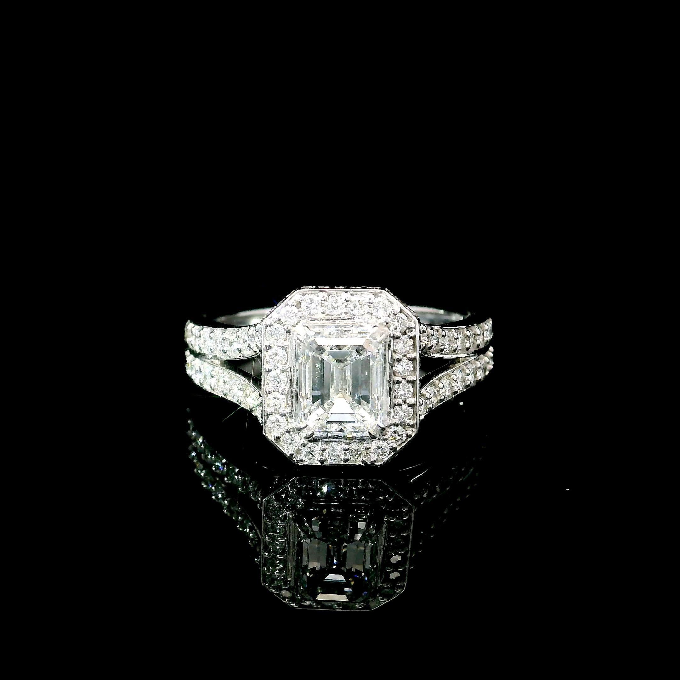 18kt white gold ring with diamonds
  
  Gold colour & karat: White gold 18kt
  Weight: 3.97 grams
  
  Set with-
  Stone type: Diamonds
  Shape: Emerald
  Carat: 1.01 ct
  Colour: E
  Clarity: SI1
  
  Surrounding Stones: Diamonds
 1) White