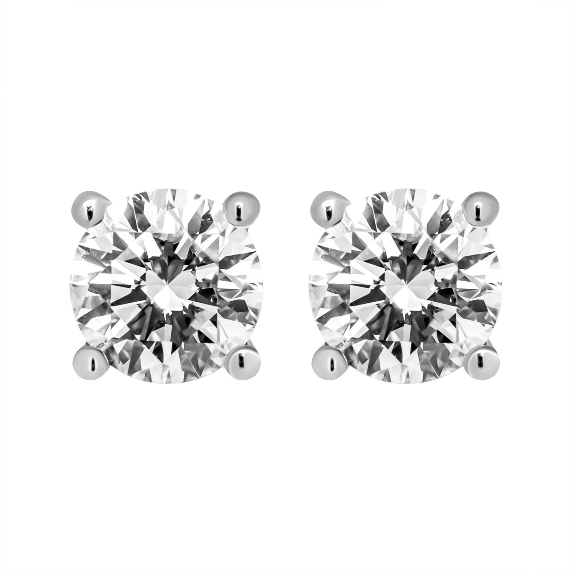 Four-Prong Round Diamond Stud Earrings in Platinum 
ROUND 4 prongs studs in Platinum 
Stones: 
 1.01ct I VS2 Round Shape Diamond GIA#2225100117 
 1.01ct I VS2 Round Shape Diamond GIA#7412773046 
Totaling: 2.02 carat

With pressure back lock system