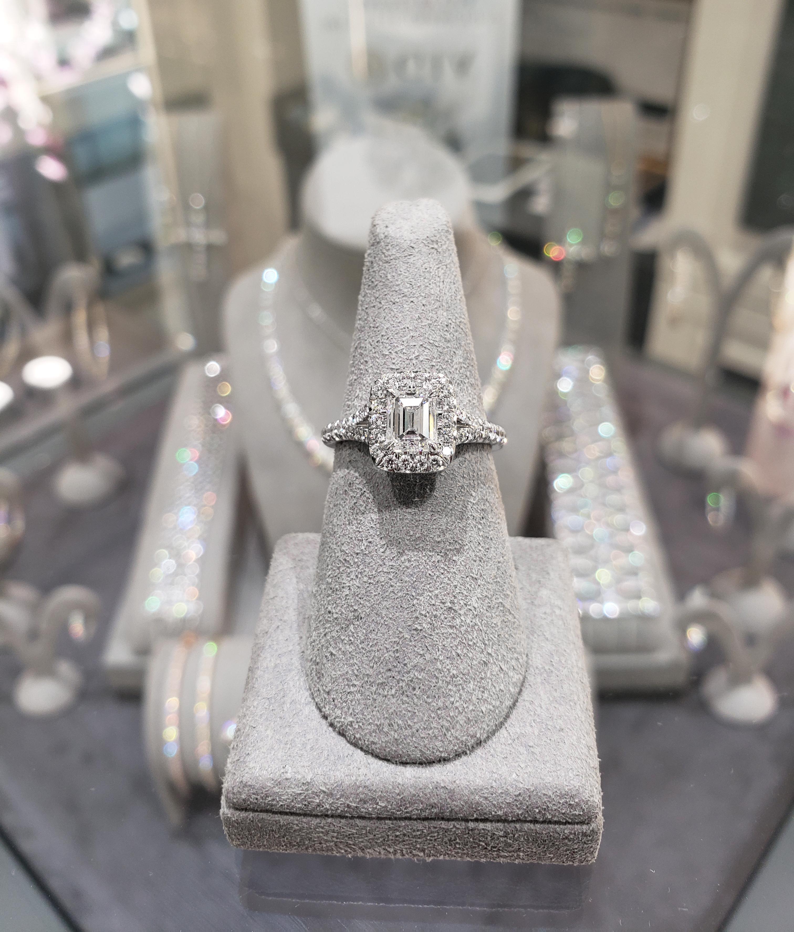 Handcrafted in everlasting platinum, this brilliant engagement ring showcases a 1.01 carat GIA Certified (D color, VS2 clarity) center diamond, surrounded by a single row of sparkling round diamonds. Set on a split-shank composition accented with