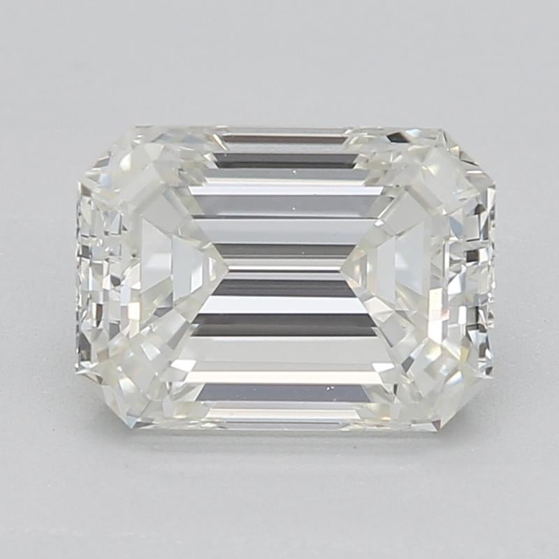 Handcrafted in New York, a captivating diamond ring that effortlessly embodies the elegance of the Art Deco era, featuring a stunning emerald center stone weighing 1.01 , graded J and VS1. This piece boasts a striking raised prong setting that