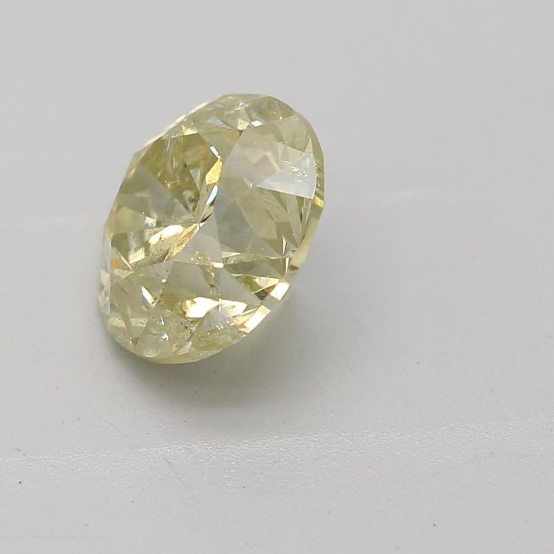 Round Cut GIA Certified 1.01 Carat Fancy Light Brownish Greenish Yellow I2 Clarity Diamond For Sale