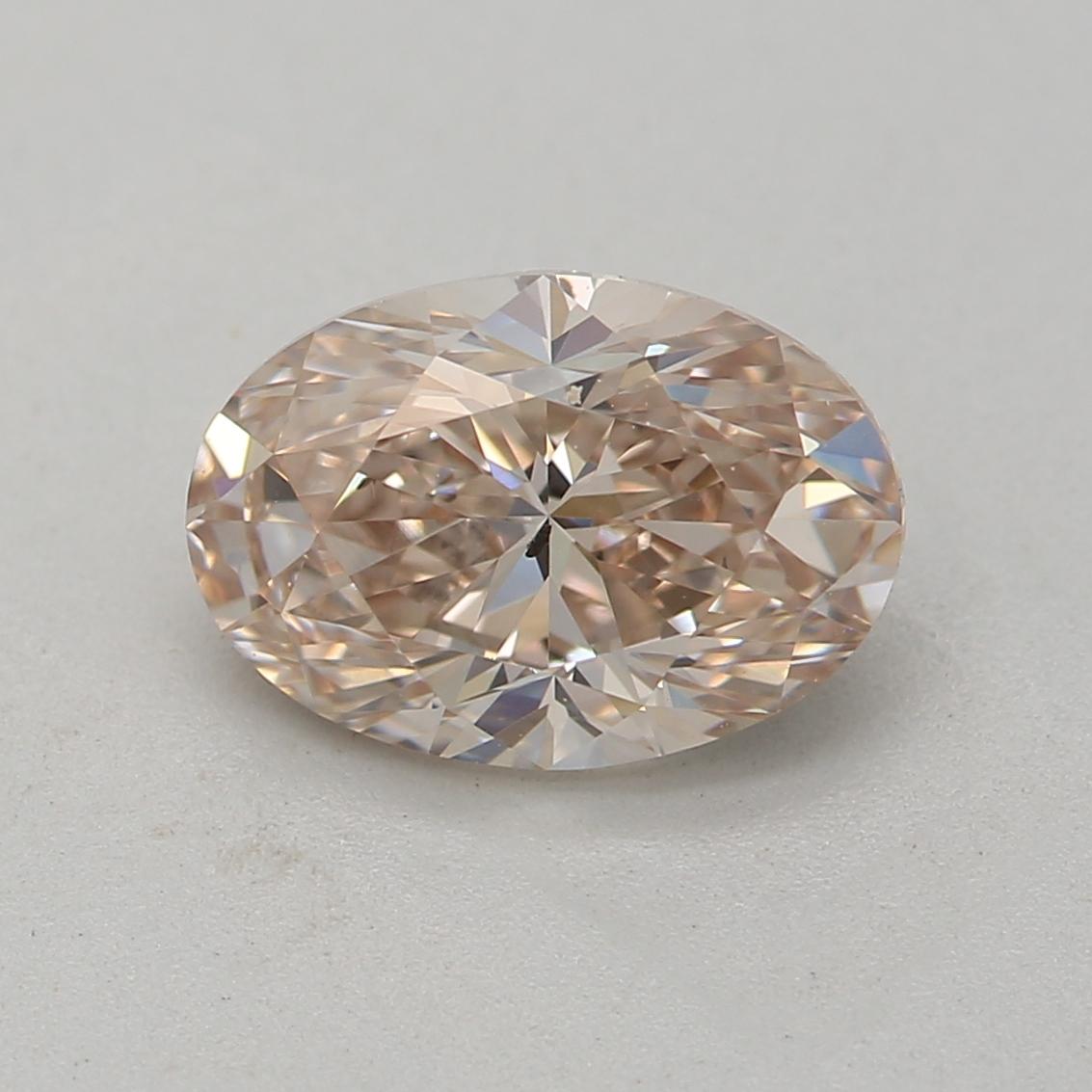 Taille ovale GIA Certified 1.01 Carat Fancy Pink Brown SI1 Clarity Diamond en vente