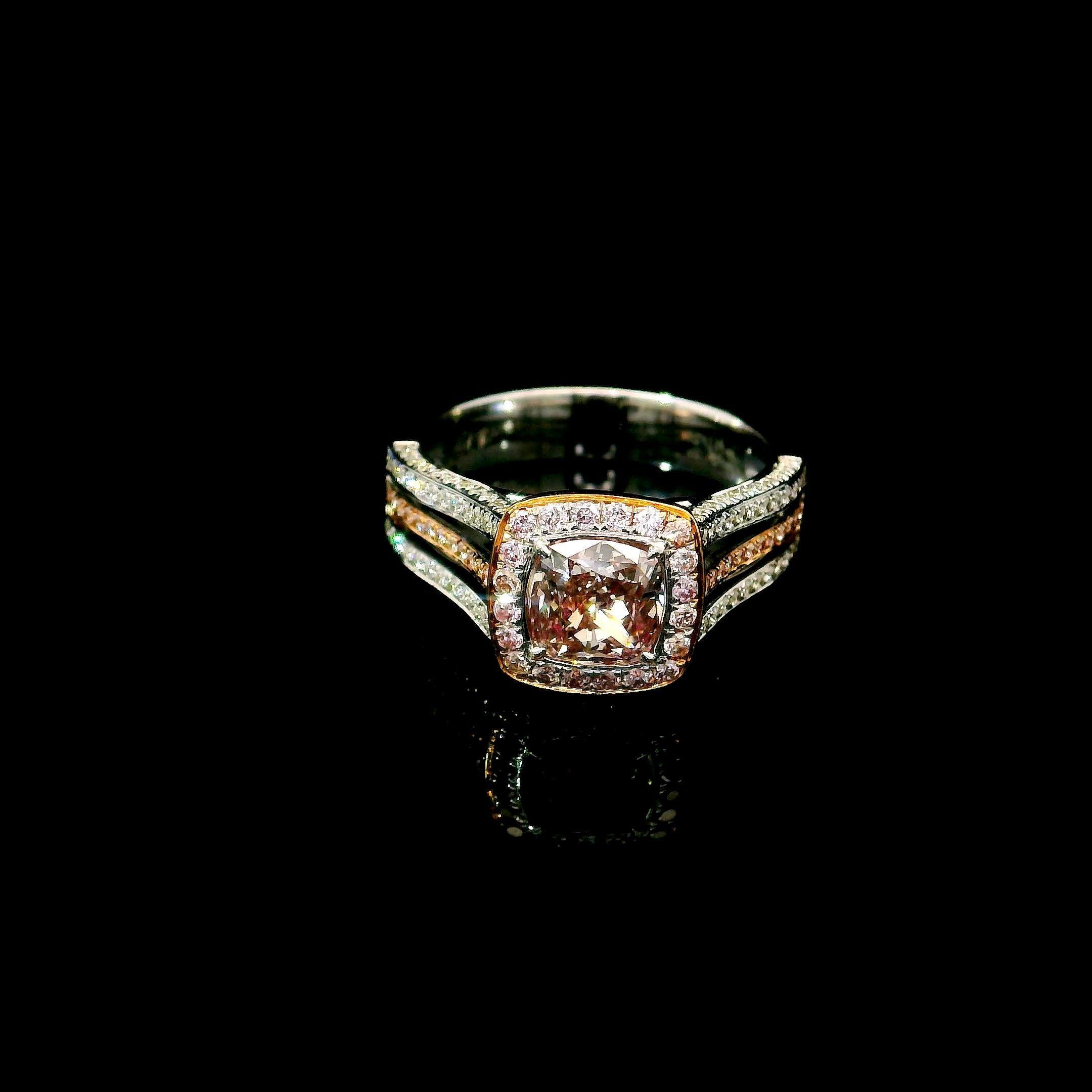 18kt white gold ring with diamonds
  
  Gold colour & karat: White gold 18kt
  Weight: 4.755 grams
  
  Set with-
  Stone type: Diamonds
  Shape: Cushion
  Carat: 1.01 ct
  Colour: Fancy Pinkish Brown
  Clarity: I2
  
  Surrounding Stones: Diamonds
