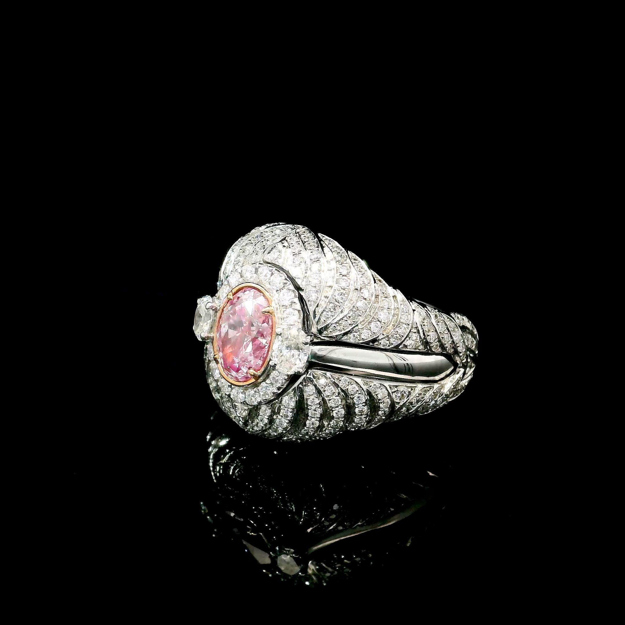 18kt white gold ring with diamonds
  
  Gold colour & karat: White gold 18kt
  Weight: 9.27 grams
  
  Set with-
  Stone type: Diamonds
  Shape: Oval
  Carat: 1.01
  Colour: Light Pink  
  Clarity: I2
  
  Surrounding Stones: Diamonds
 1) White