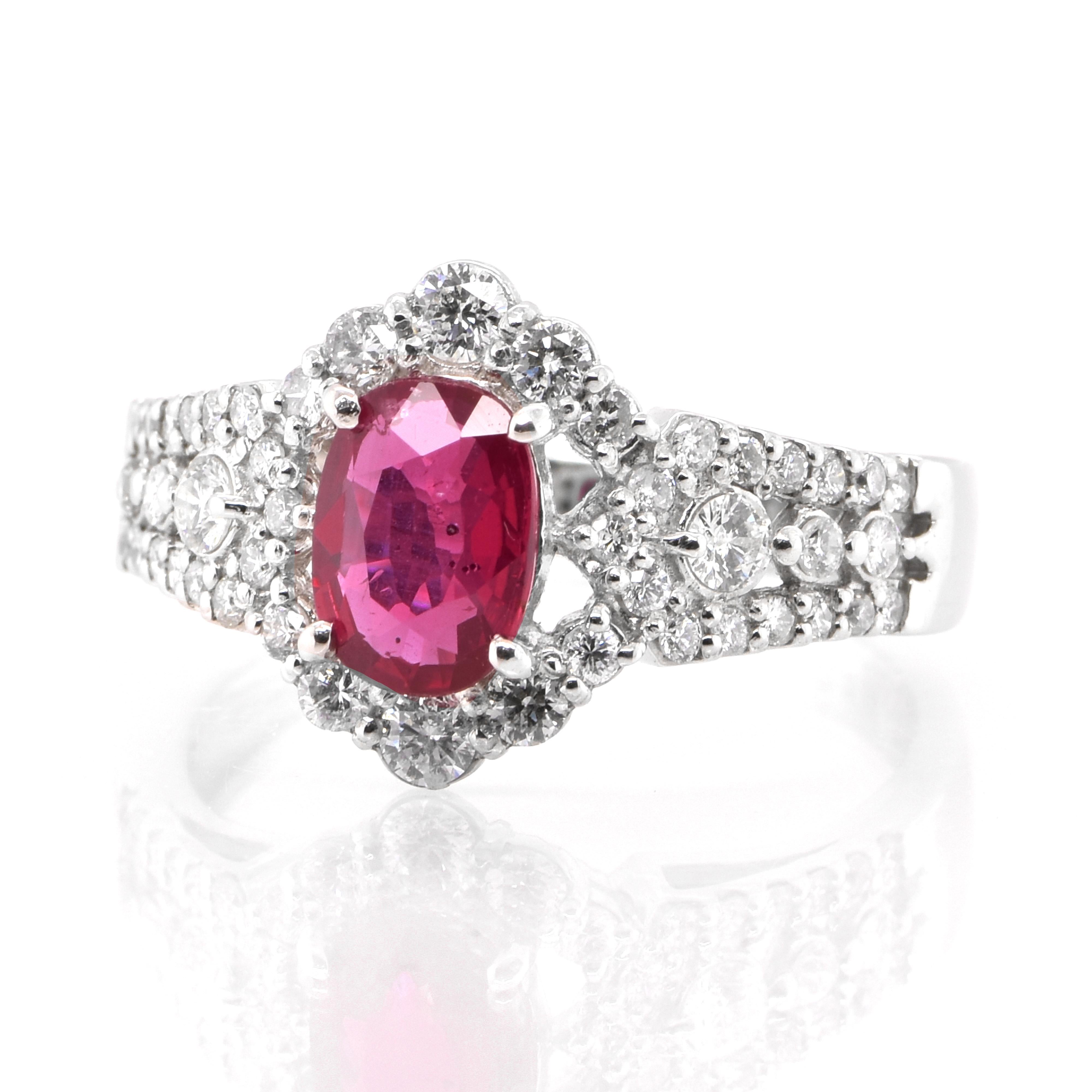 A beautiful Engagement Ring set in Platinum featuring a GIA Certified 1.01 Carat, Natural Untreated (No Heat) and Unfilled Ruby and 0.53 Carats of Diamond Accents. Rubies are referred to as 