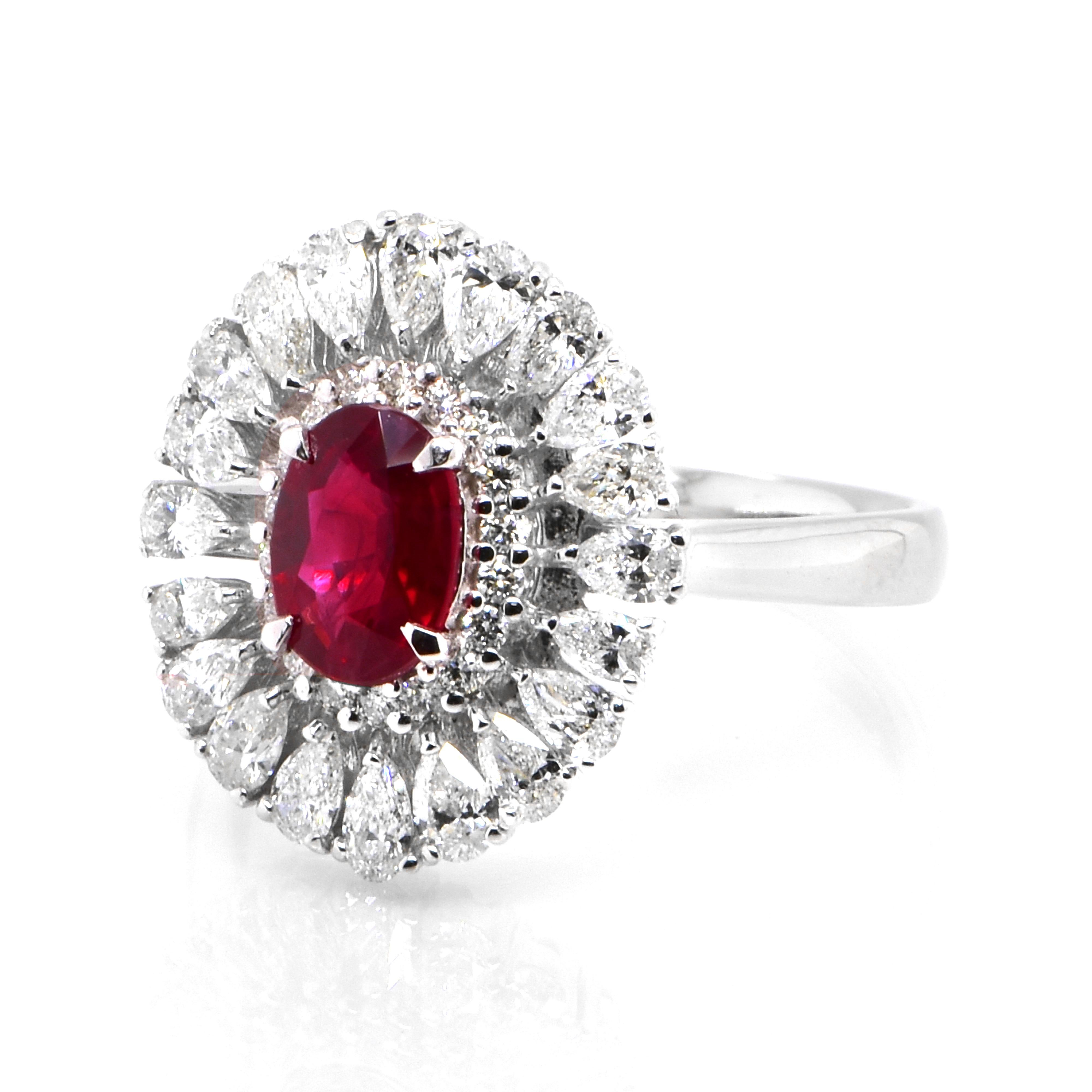 A beautiful Ring set in Platinum featuring a GIA Certified 1.01 Carat Natural, Pigeons Blood Red, Burmese Ruby and 1.16 Carat Diamonds. Rubies are referred to as 