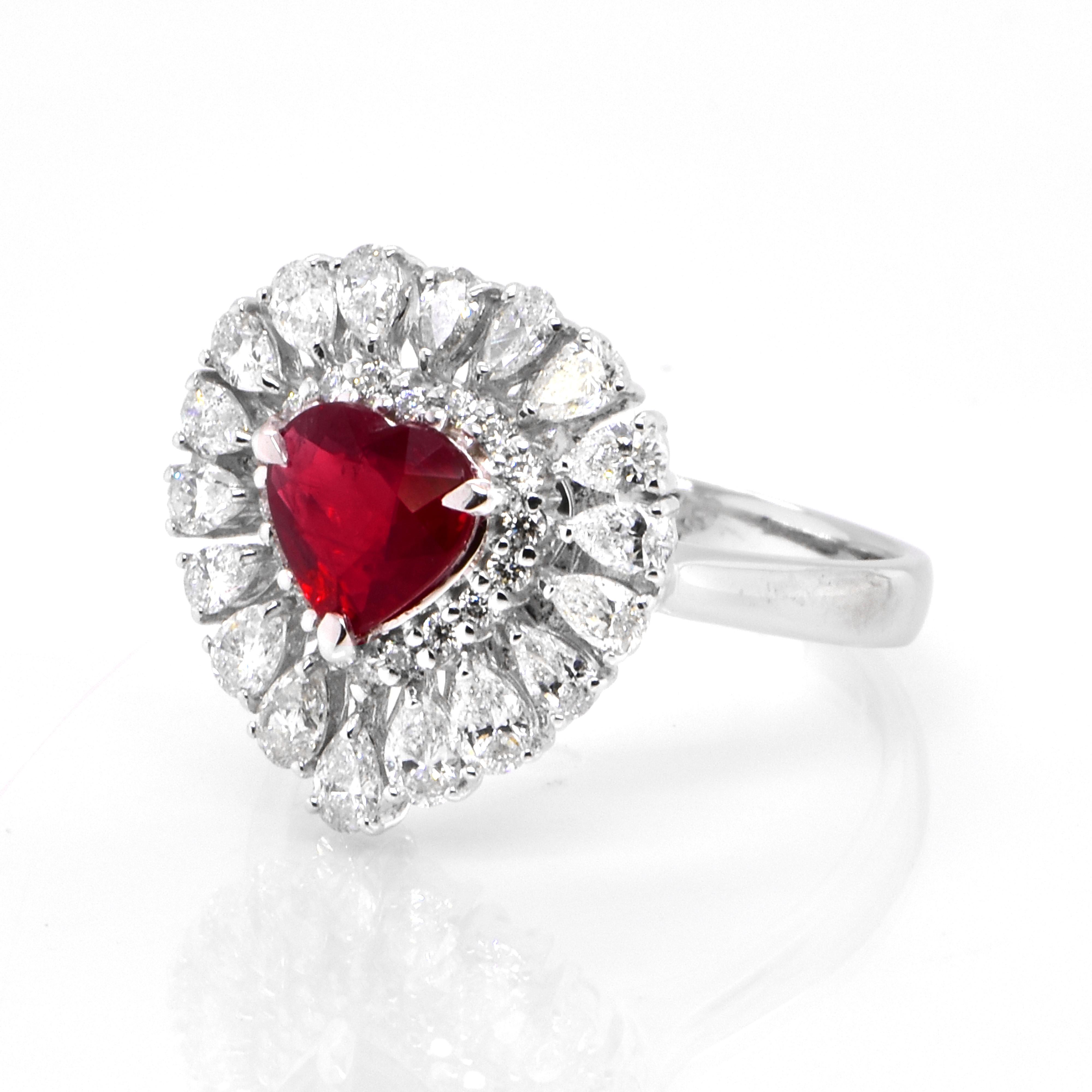A beautiful Ring set in Platinum featuring a GIA Certified 1.01 Carat Natural, Pigeons Blood Red, Burmese Ruby and 1.08 Carat Diamonds. Rubies are referred to as 