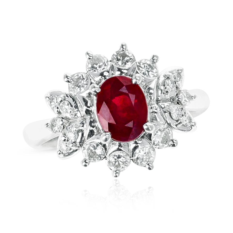 A GIA Certified 1.01 ct. Oval Pigeon Blood Burma Ruby and 0.45 ct. Diamond Ring made in Platinum. The ruby contains a certificate from GIA. The ring size is 4.25 US and the total weight of the ring is 6.48 grams. 