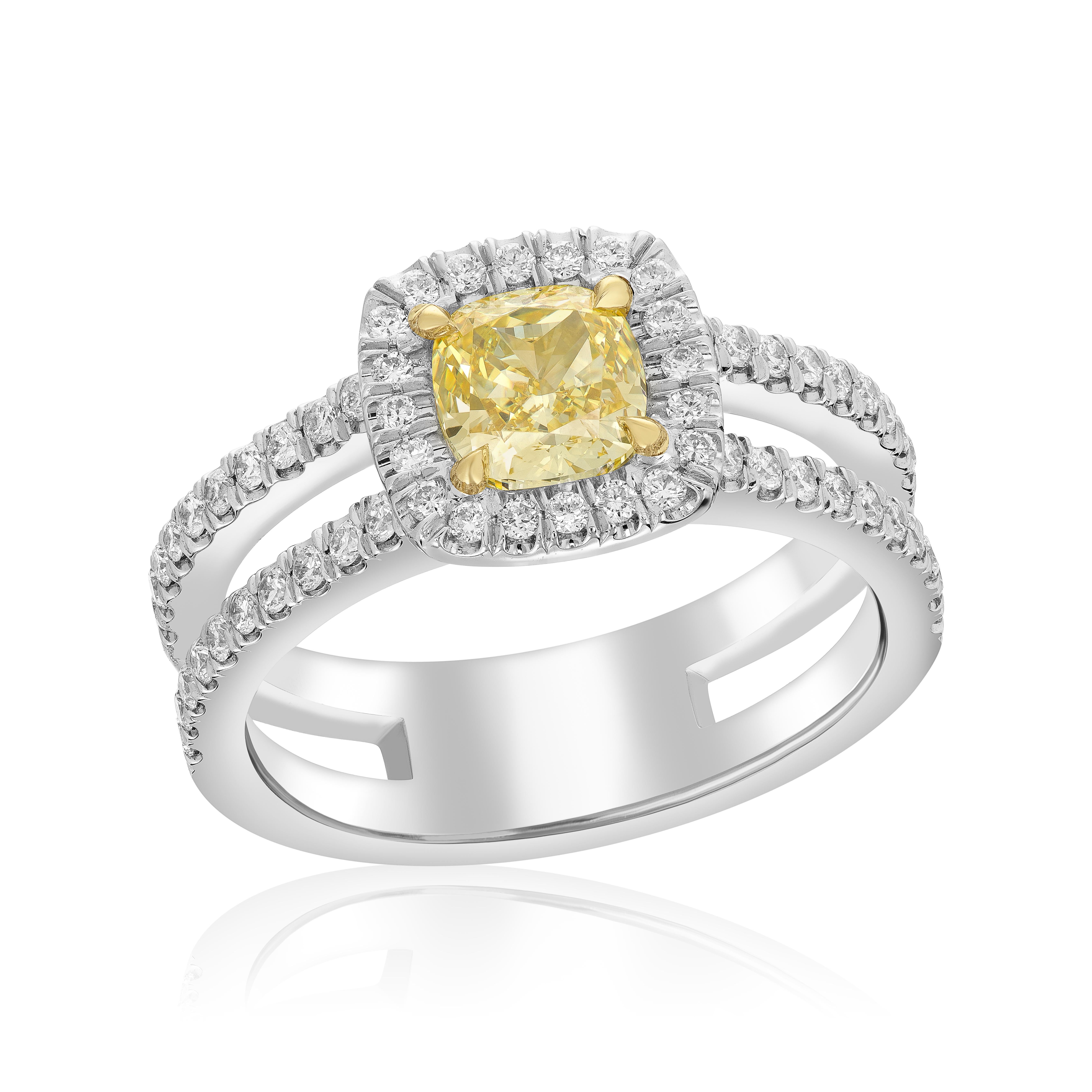 Make a statement with this stunning handmade double-shank halo ring! This one-of-a-kind ring features a beautiful 1.01 carat fancy intense yellow cushion, SI1, certified by the esteemed GIA with a unique number of 1349145507. The cushion is set in