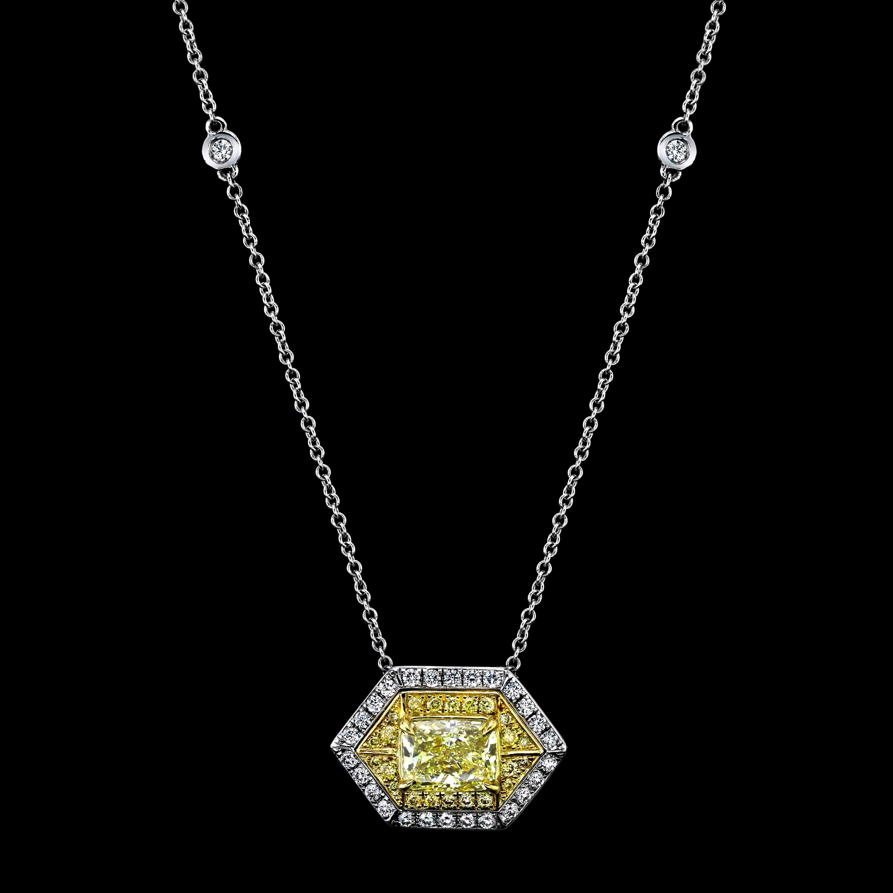 This dainty Cushion cut yellow Diamond is graded by GIA as Fancy Intense. 
It is set in 18k White and Yellow Gold Surrounded by:

22 Yellow diamonds = 0.12cttw

And 27 Round colorless Diamonds = 0.20cttw

and 6 Round Diamonds on-chain =