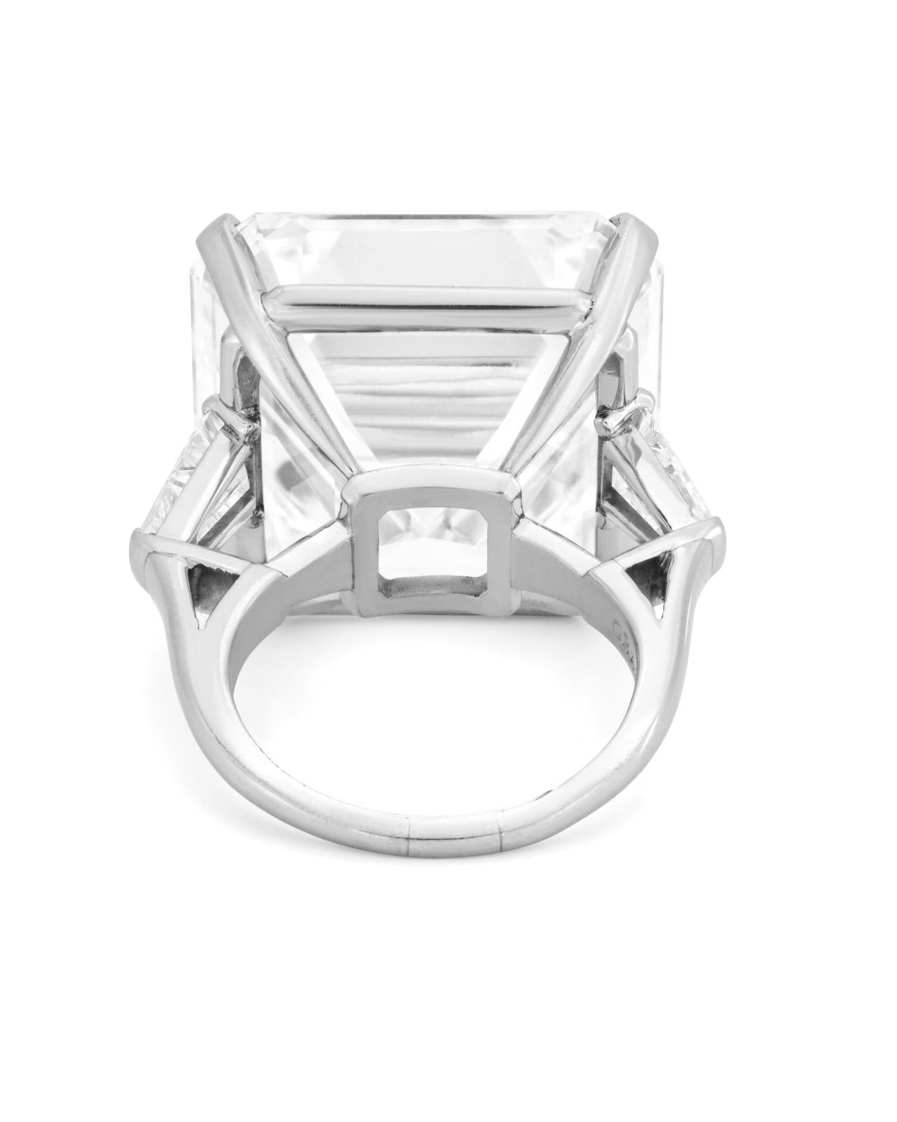 GIA-certified emerald cut diamond ring, featuring a stunning 10.12 carat diamond at its center. This exquisite diamond demonstrates exceptional clarity and brilliance, making it a true statement piece. 

Flanked by elegant tapered baguette diamonds,