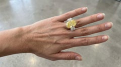 GIA Certified 10.14 Carat Fancy Yellow Oval Diamond Three-Stone Ring