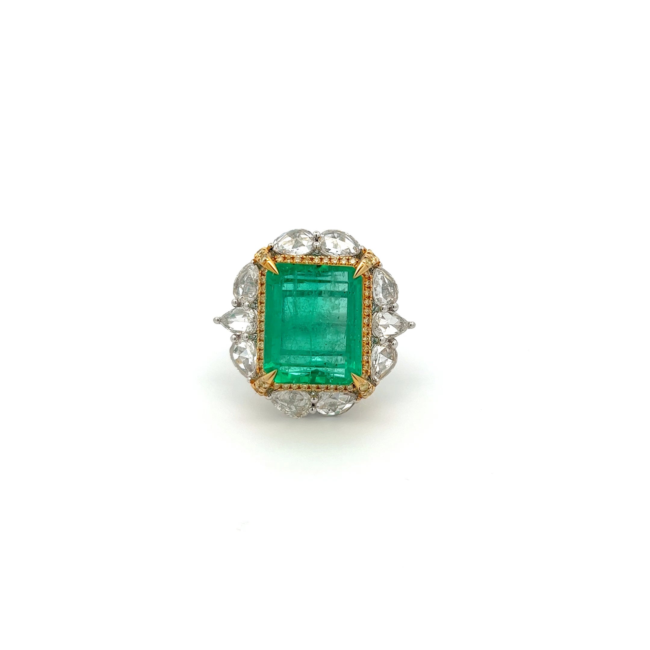Introducing our stunning GIA certified 10.15 carat Colombian Emerald Ring in 18K Two-tone Gold, accented with 2.73 carats of pear-shaped rose-cut diamonds. This exquisite ring boasts a rare and highly sought-after Colombian emerald, renowned for its