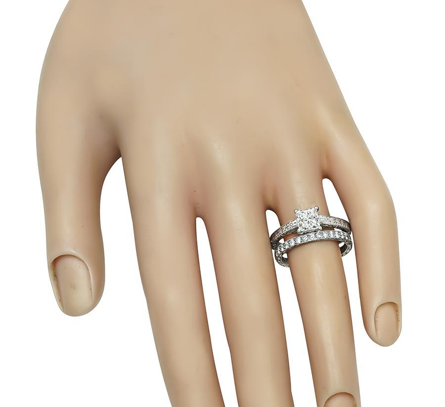 This is a stunning platinum engagement ring and wedding band set. The engagement ring is centered with a sparkling GIA certified princess cut diamond that weighs 1.01ct. The color of the diamond is G with VS2 clarity. The wedding band is set by