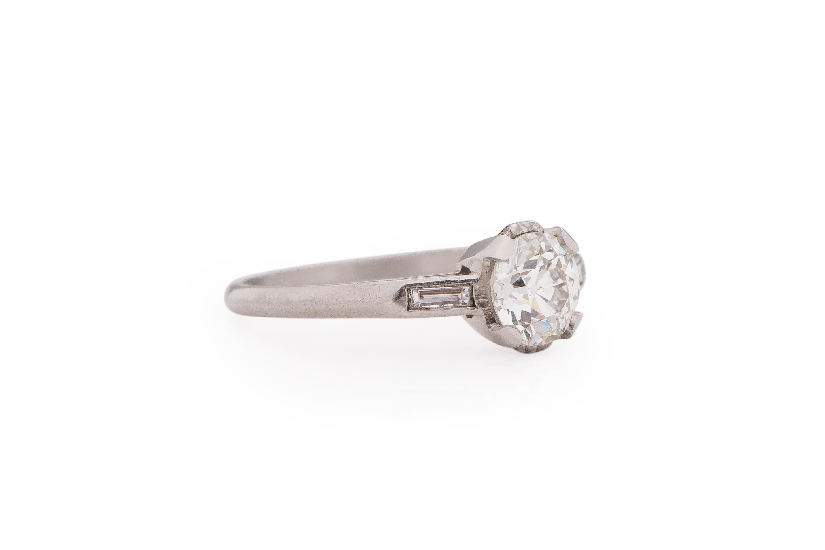 Ring Size: 7
Metal Type: Platinum [Hallmarked, and Tested]
Weight: 3.2 grams

Center Diamond Details:
GIA REPORT #: 2215236425
Weight: 1.02 carat
Cut: Old European brilliant
Color: J
Clarity: VS1

Side Stone Details:
Weight: .15 carat total
