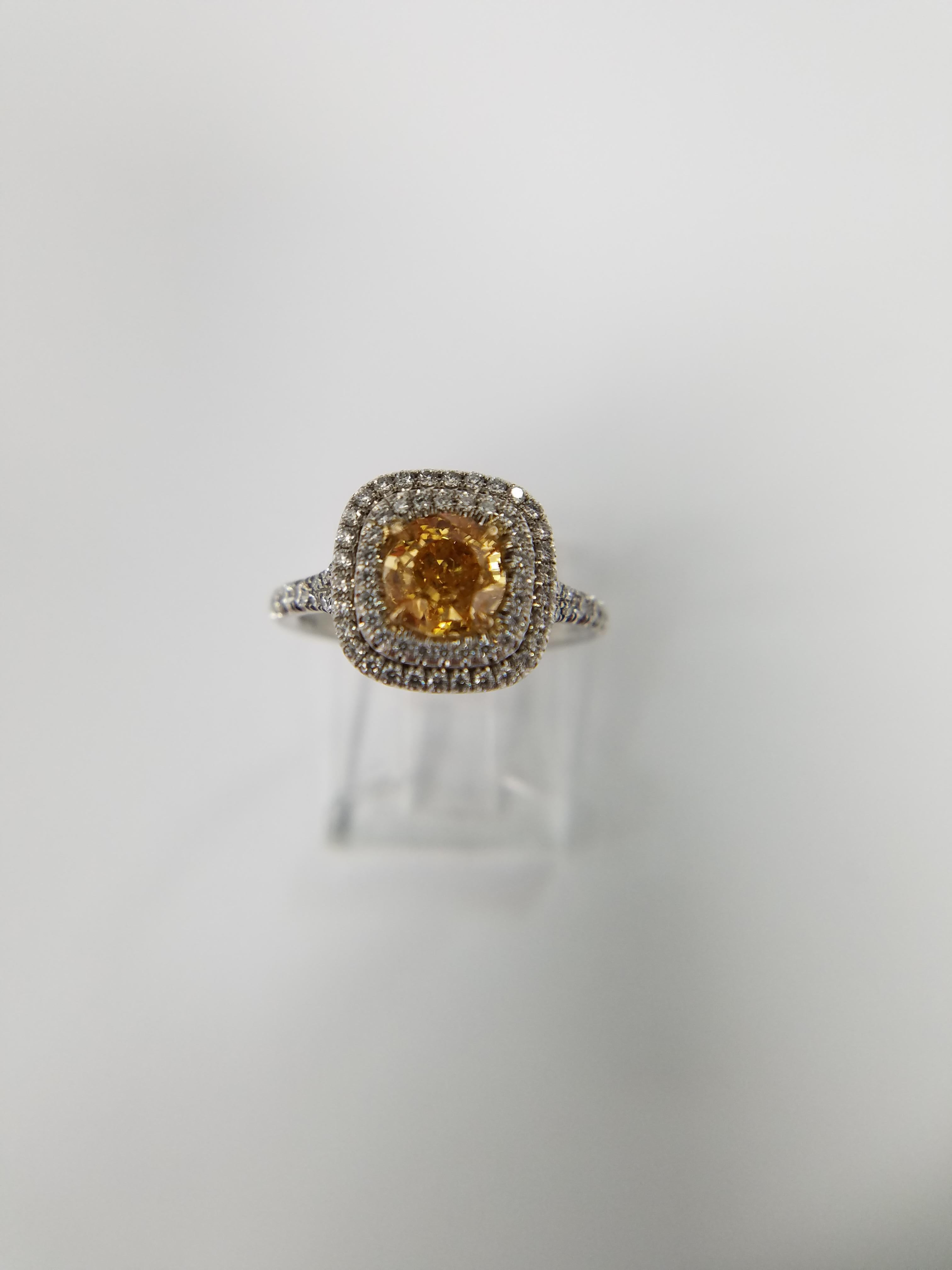 GIA Certified 1.02 carat Diamond Natural Fancy Intense Yellow Orange Color set in a platinum and 18 K yellow gold with 83 white diamonds weighing 0.53 carats. This is a very rare natural color diamond that is Orange colored.  
GIA report # 15127113