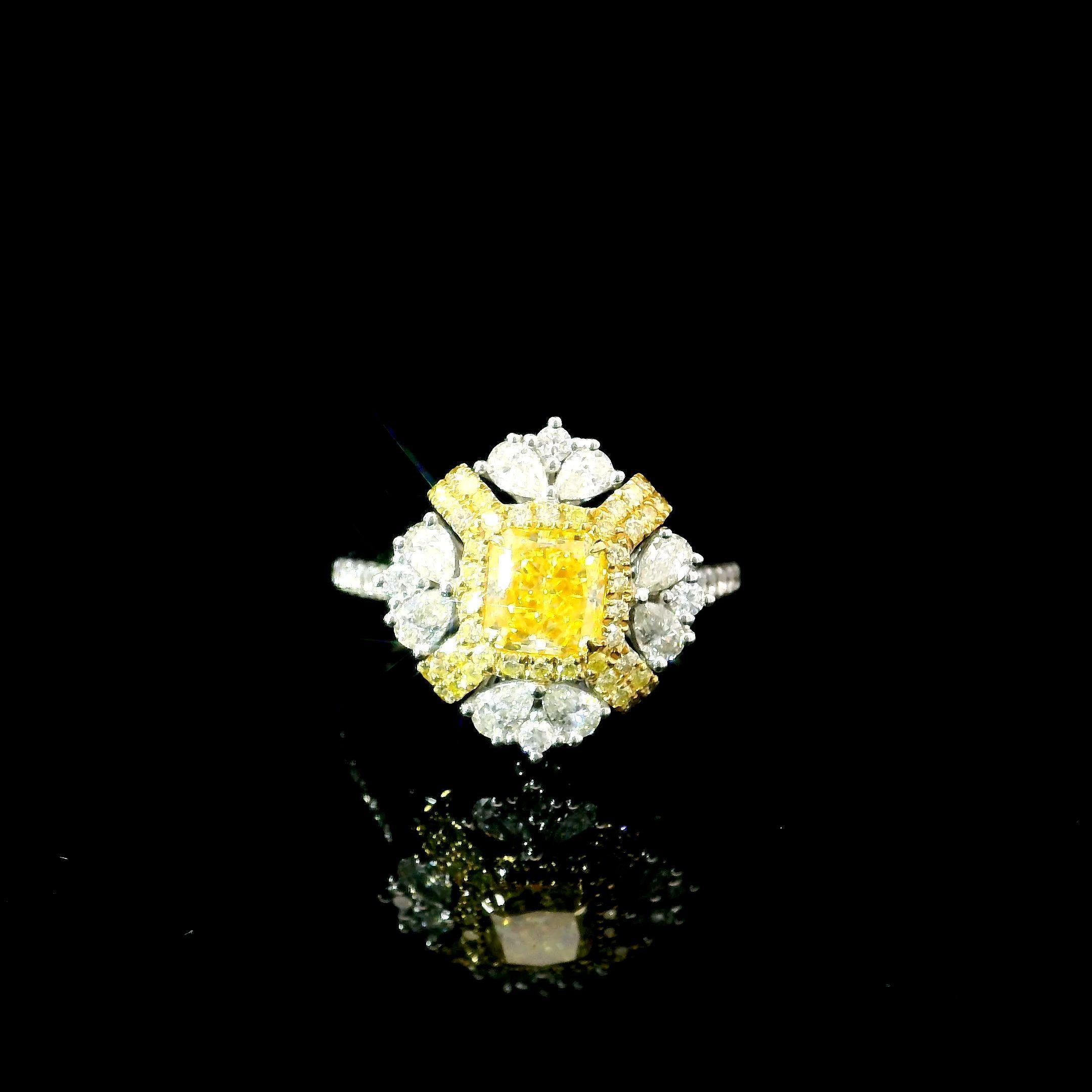 18kt white gold ring with diamonds
  
  Gold colour & karat: White gold 18kt
  Weight: 5.55 grams
  
  Set with-
  Stone type: Diamonds
  Shape: Radiant
  Carat: 1.02
  Colour: Fancy Intense Yellow  
  Clarity: I1
  
  Surrounding Stones: Diamonds
