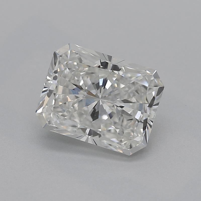 Handcrafted in New York, this exquisite diamond ring showcases a captivating radiant G VS1 1.02 center stone, brilliantly set in a classic four-prong setting that elevates its radiant beauty. The ring is elegantly adorned with shimmering tapered