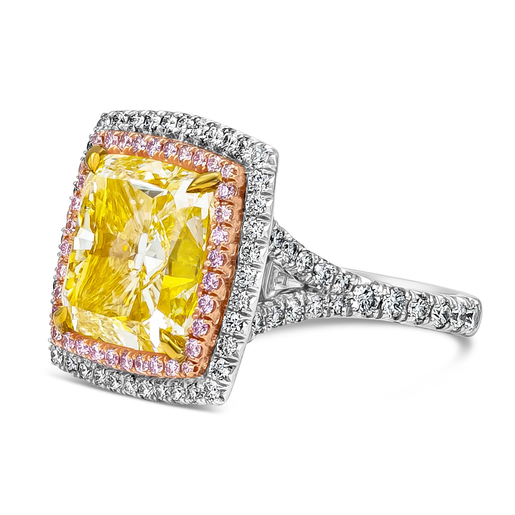 A beautiful and elegantly made, statement engagement ring features a GIA Certified 10.27 carat total cushion cut fancy yellow diamond, VS2 in Clarity. Surrounded by double halo with pink diamonds on the inner halo weighing 0.30 carats total, and