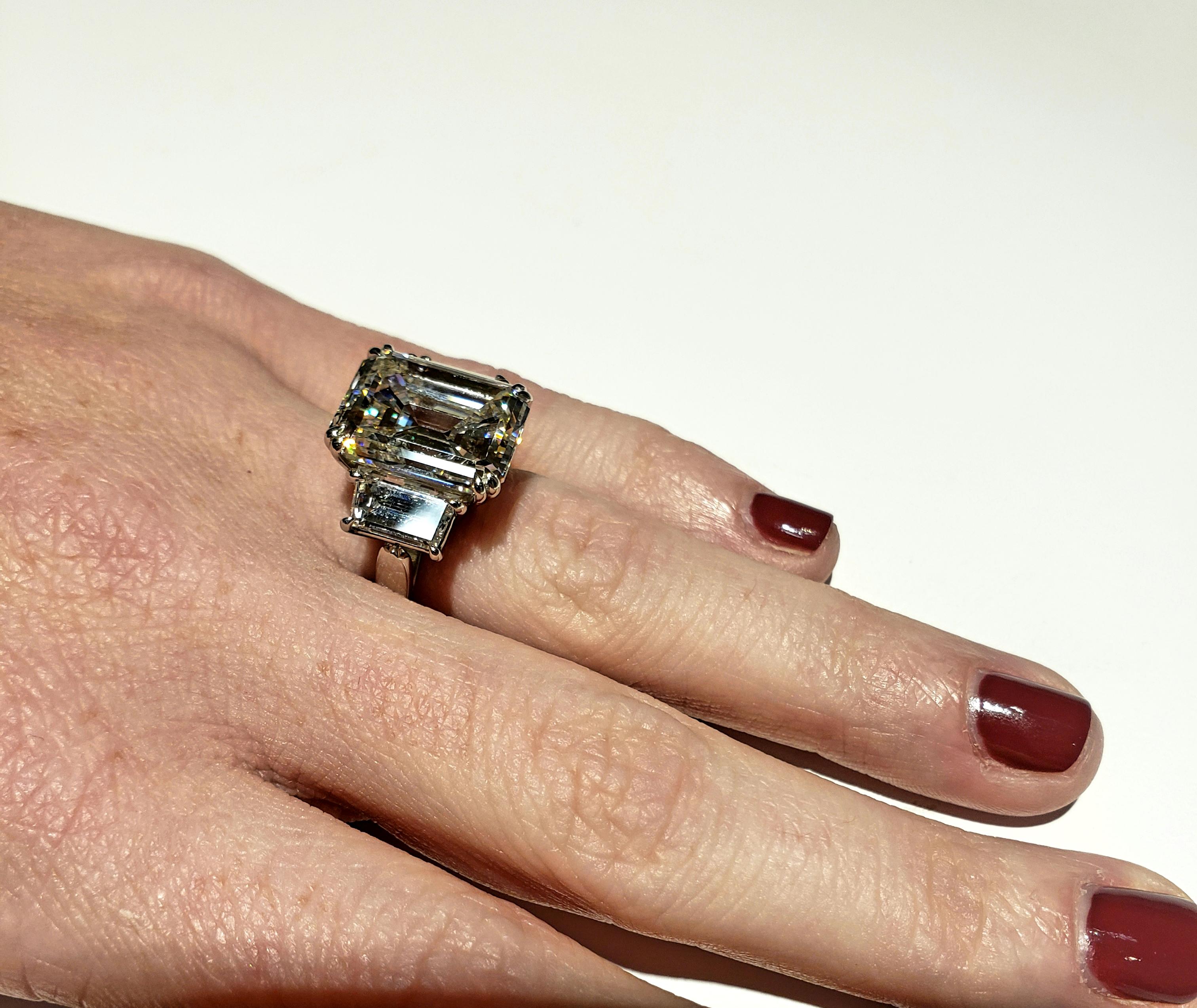 **LOWER PRICE**  Originally $390,000. NOW $325,000.!!!
A beautiful GIA certified 10.29 carat emerald cut diamond I color / VS1 clarity, set in an entirely handmade platinum mounting.
Ring has emerald cut stones on either side. 1.04 carats each.