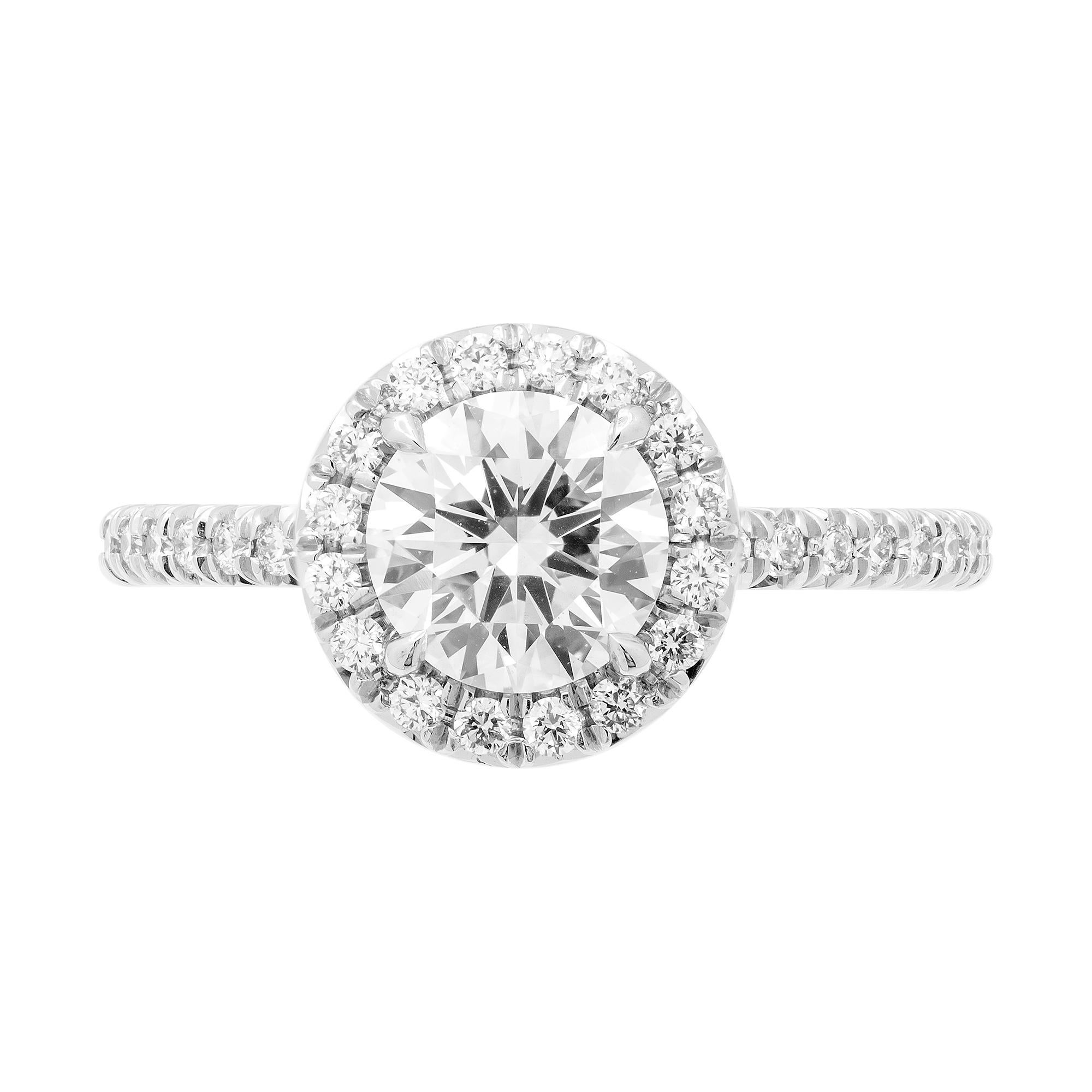Mounted in handmade custom design setting featuring Platinum 950, diamond shank, that forms beautiful gallery under center stone, a true piece of art,
Halo around center stone makes it appear larger, looks like true 2 carat. Setting features