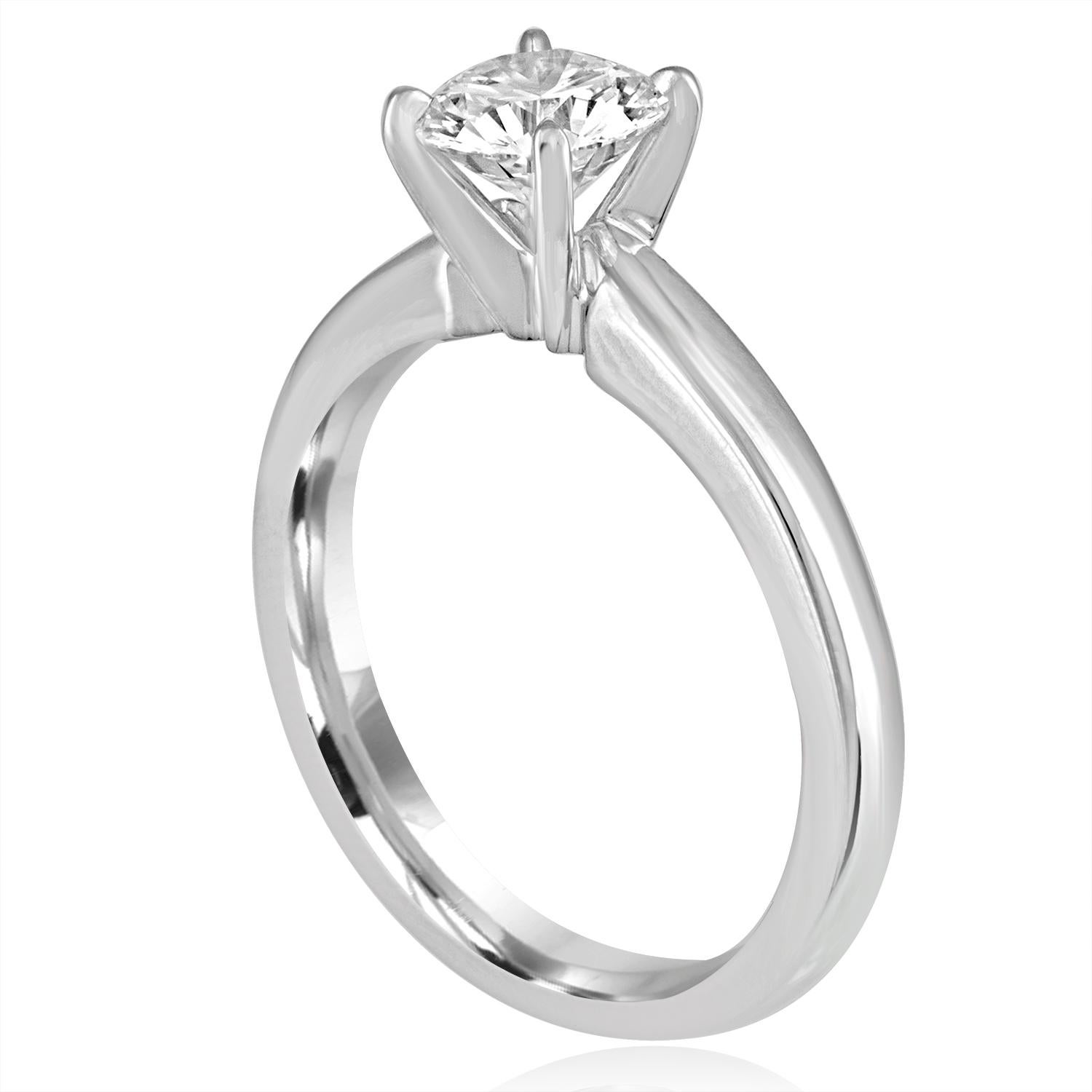 Solitaire Engagement Ring
The ring is Platinum
The center Is Round Cut Stone, GIA Certified 1.03 Carat F VVS2
The ring is a size 7, sizable.
The ring weighs 7.4 grams
We can resize free of charge, the ring becomes final sale, no returns.
