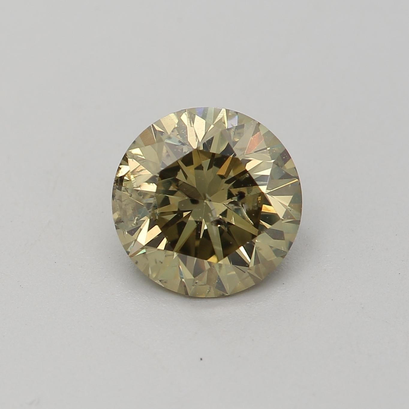 Certificate: GIA 
Report Number: 6432898811
Shape And Cut: Round
Carat Weight: 1.03 carat
Measurements: 6.46 x 6.44 x 4.02 mm
Color Grade: Fancy Dark Brown Greenish Yellow

FEATURES OF THE DIAMOND:

This fancy dark brown greenish yellow diamon